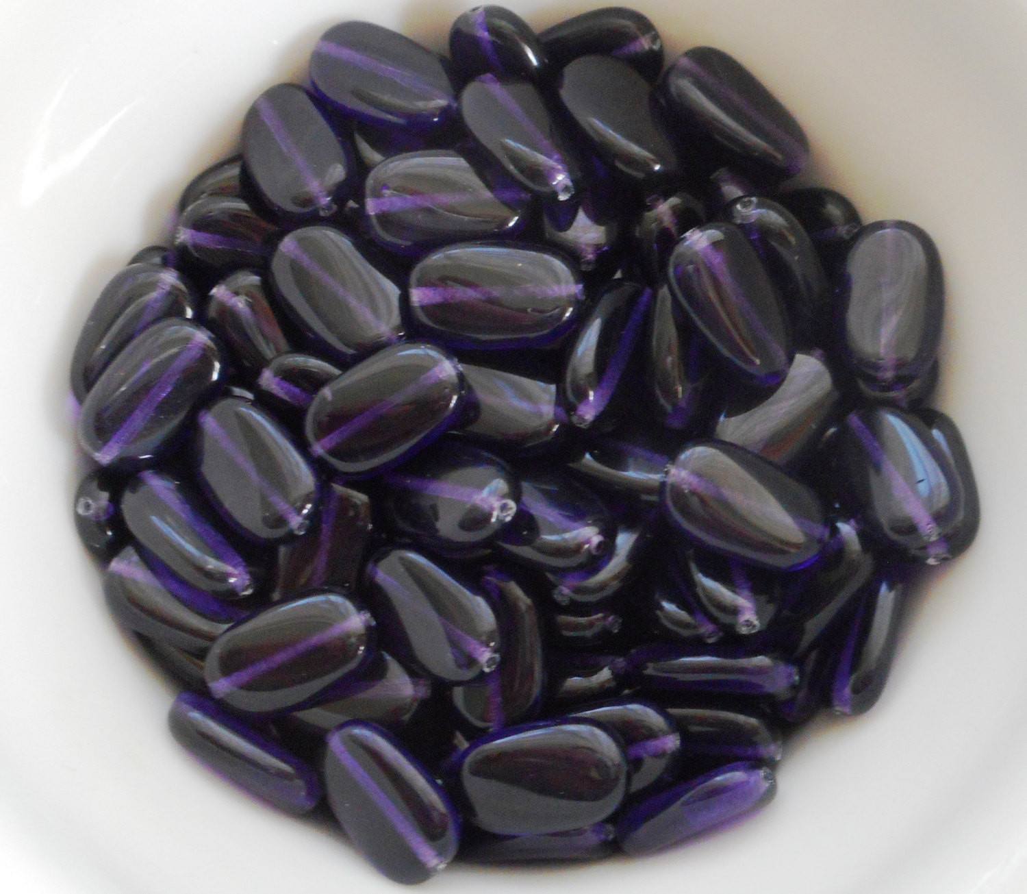 Lot of 25 Deep Violet, Purple, Amethyst slightly twisted oval Czech Glass beads, 14mm x 8mm pressed glass beads C6425 - Glorious Glass Beads