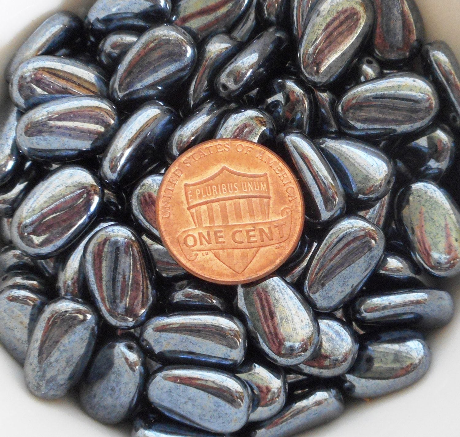 Lot of 25 Metallic Gray Hematite slightly twisted oval Czech Glass beads, 14mm x 8mm pressed glass beads C3225 - Glorious Glass Beads