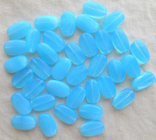 Lot of 15 Powder Blue Opal slightly twisted oval Czech pressed Glass beads, 14mm x 8mm C0008