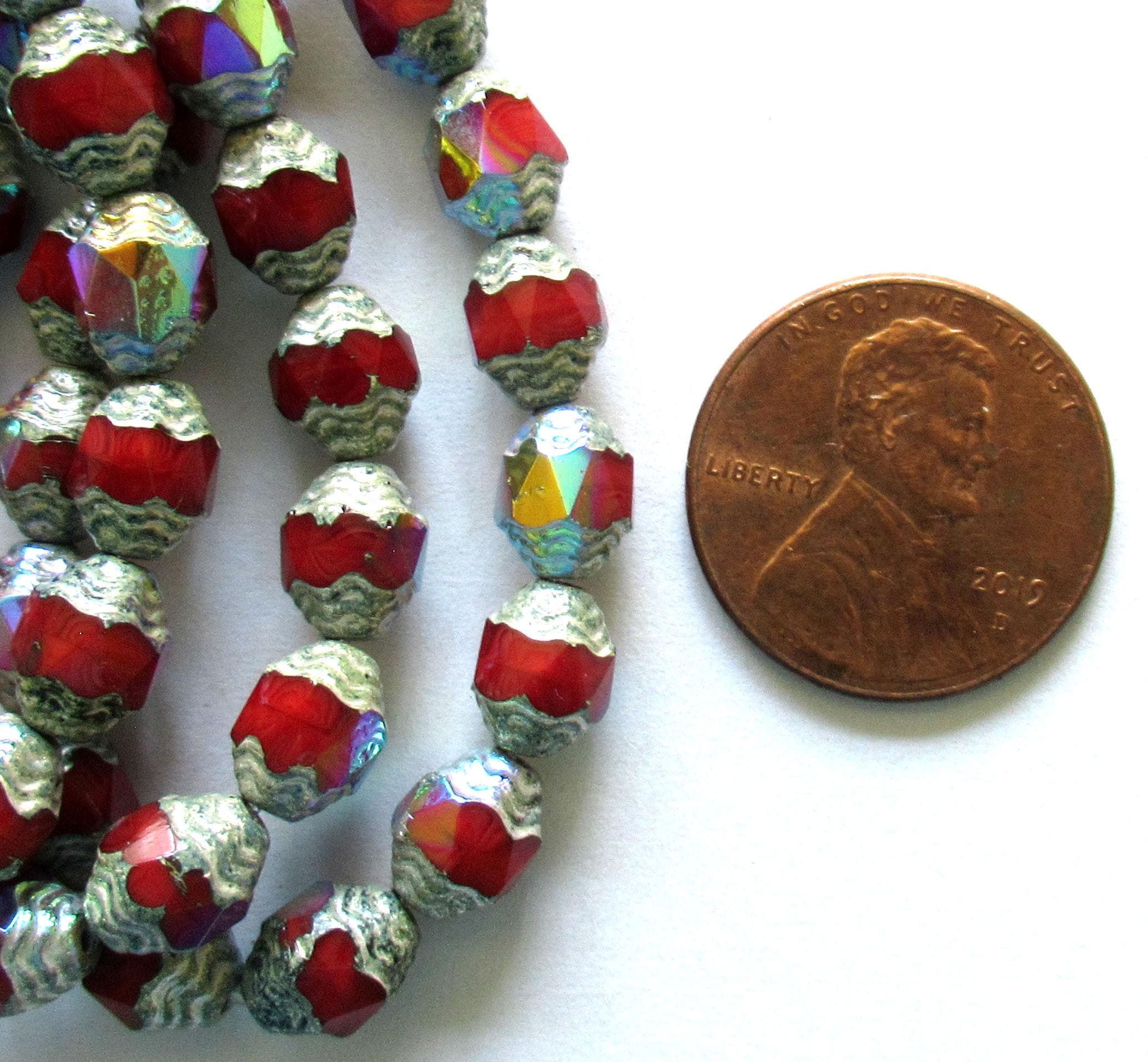 15 Czech glass mini antique style faceted oval beads - 8 x 6mm - red with silver accents & rainbow ab finish - cathedral beads - C00672