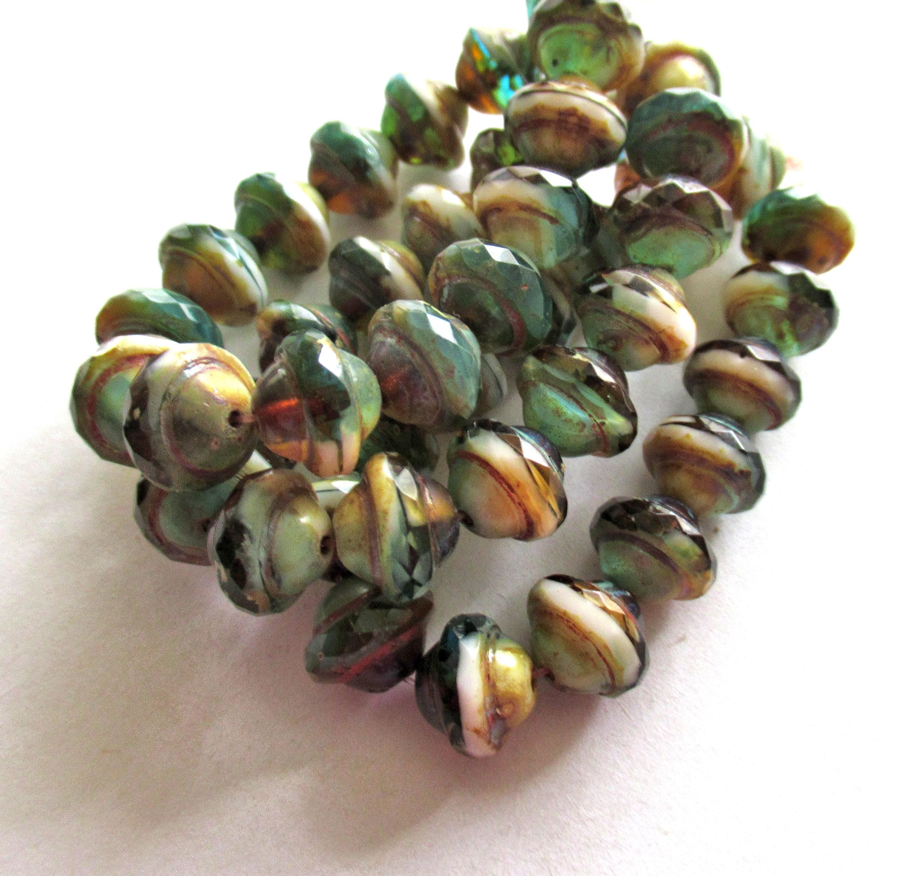 Fifteen Czech glass faceted saturn / saucer beads - 8 x 10mm - amber / blue green & white marbled mix with a picasso accents - C00302
