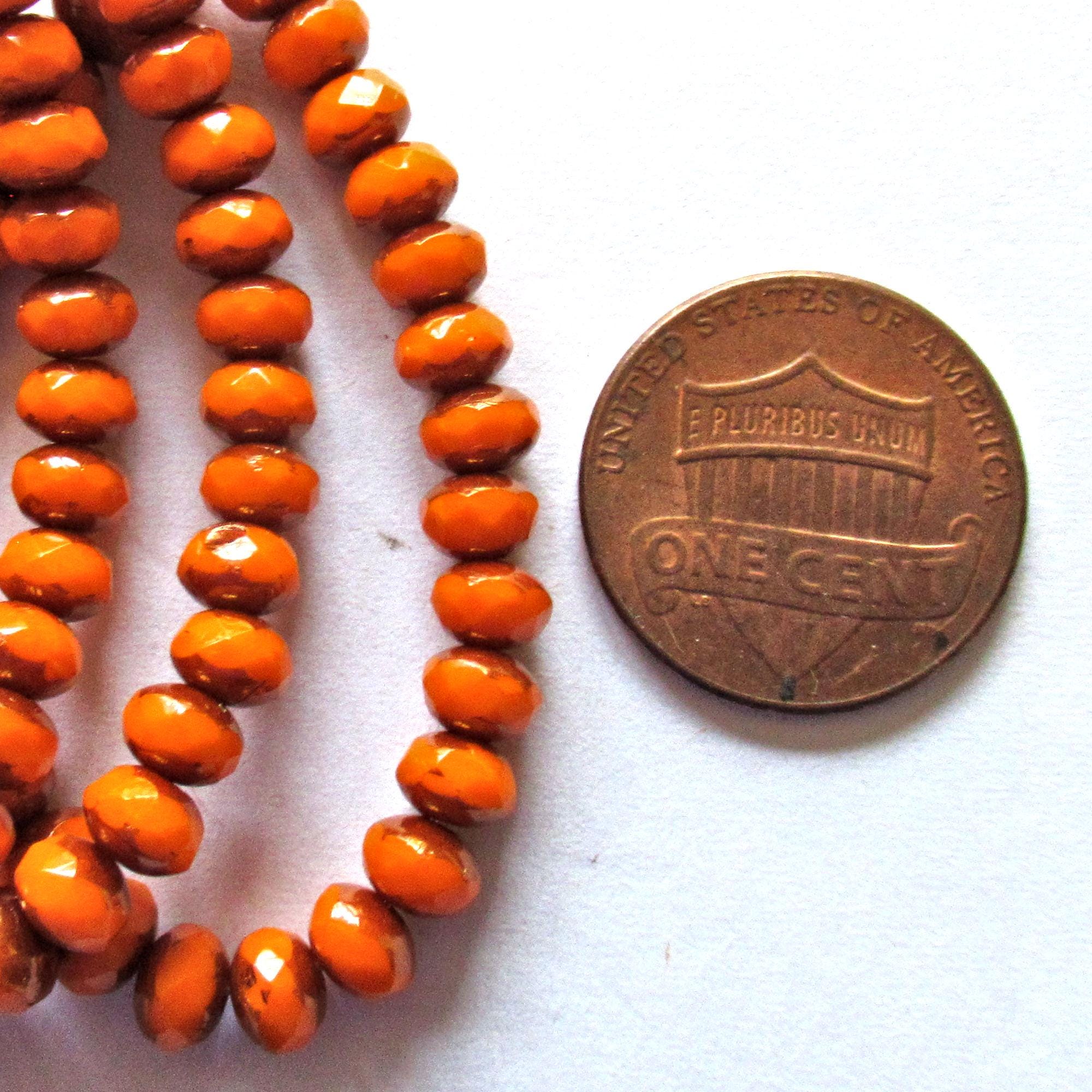 30 small Czech glass puffy rondelle beads - 3mm x 5mm - opaque bright pumpkin orange w/bronze accents - 00041