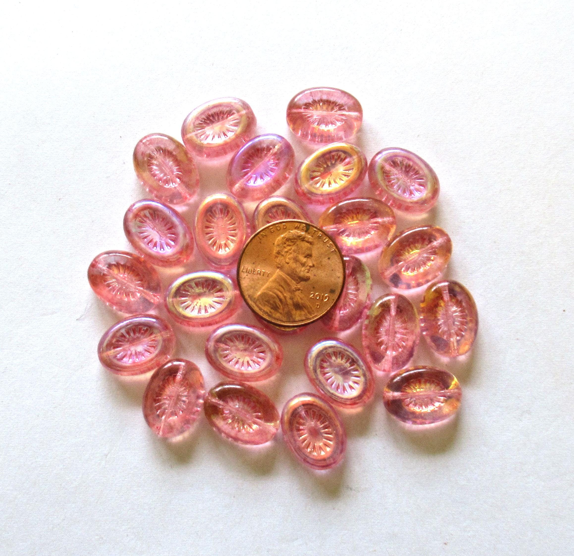 Ten Czech glass oval kiwi beads - 14 x 11mm - transparent pink with an AB finish on one side - C00361