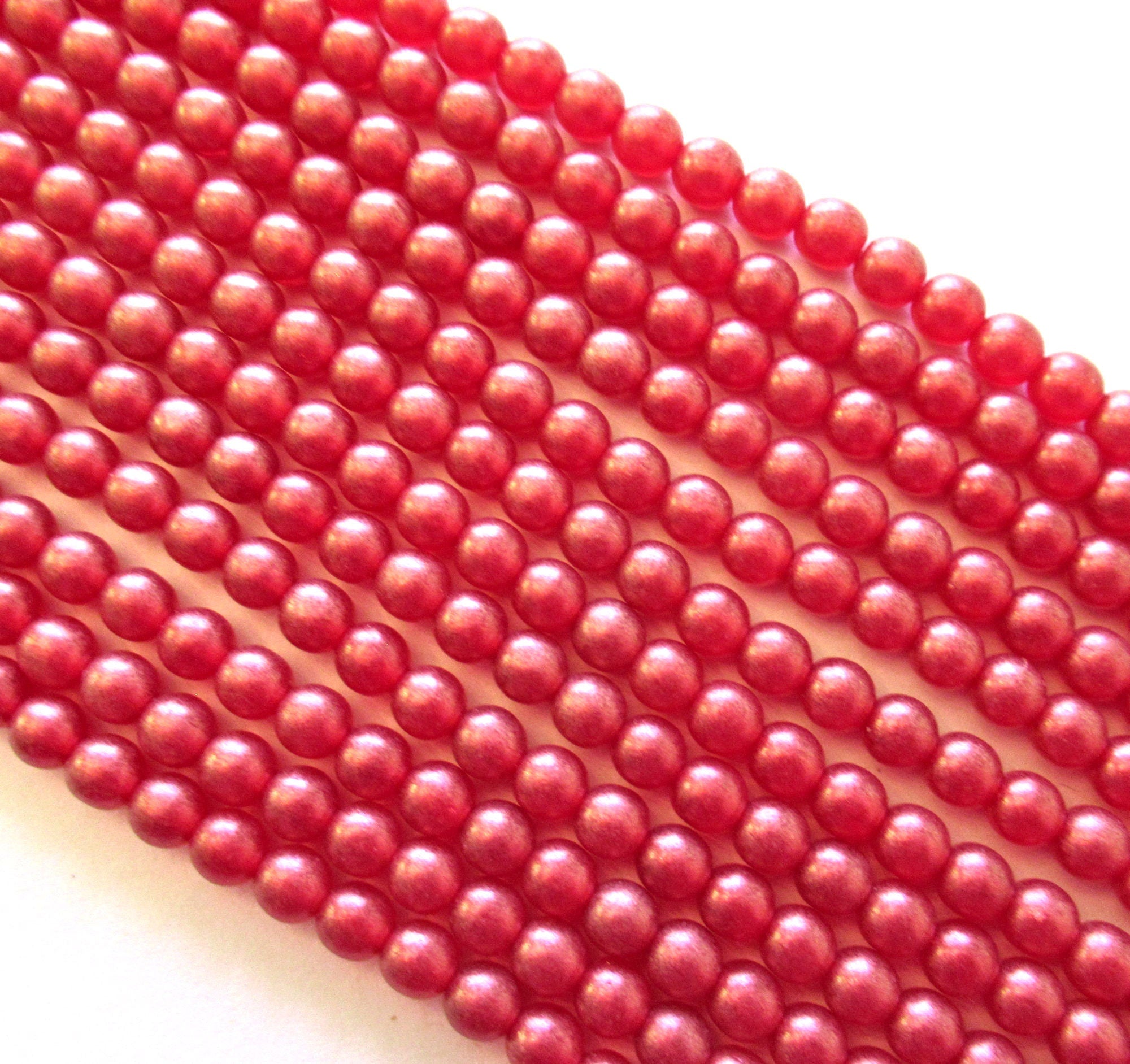Fifty 6mm Czech glass druk beads - Cosmic Twinkle Siam Ruby Red smooth round druks - C0009