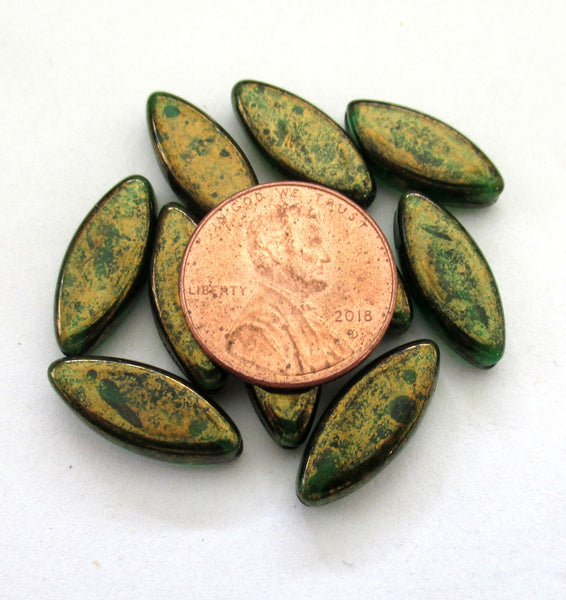 Ten Czech glass spindle beads - transparent emerald green w/ a splotchy bronze finish - 18 x 7mm table cut almond shaped beads C00191