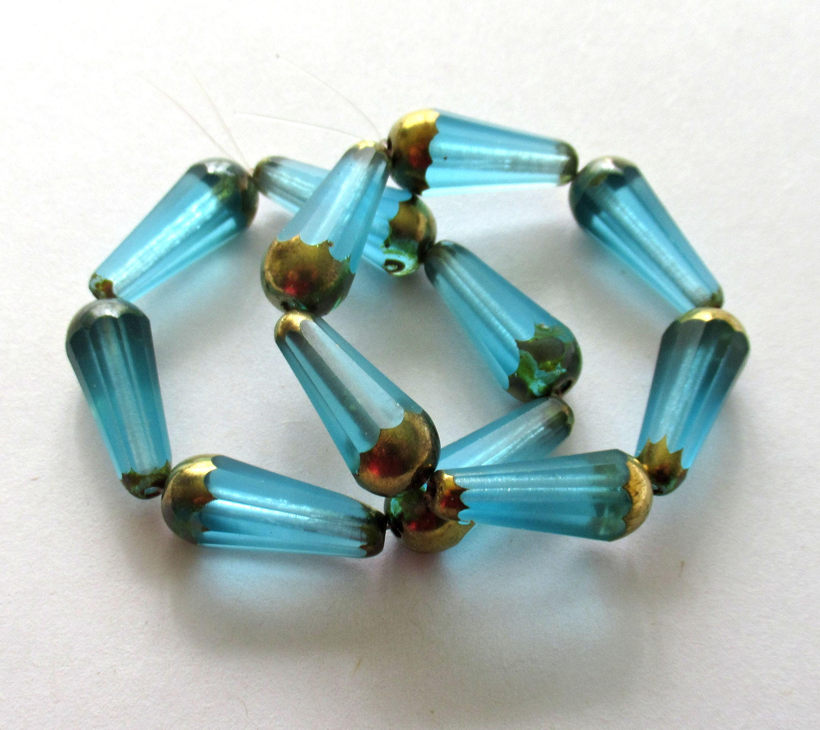 Six Czech glass long faceted teardrop beads - transparent aqua blue w/ bronze accents - 9 x 20mm tear drop 00362
