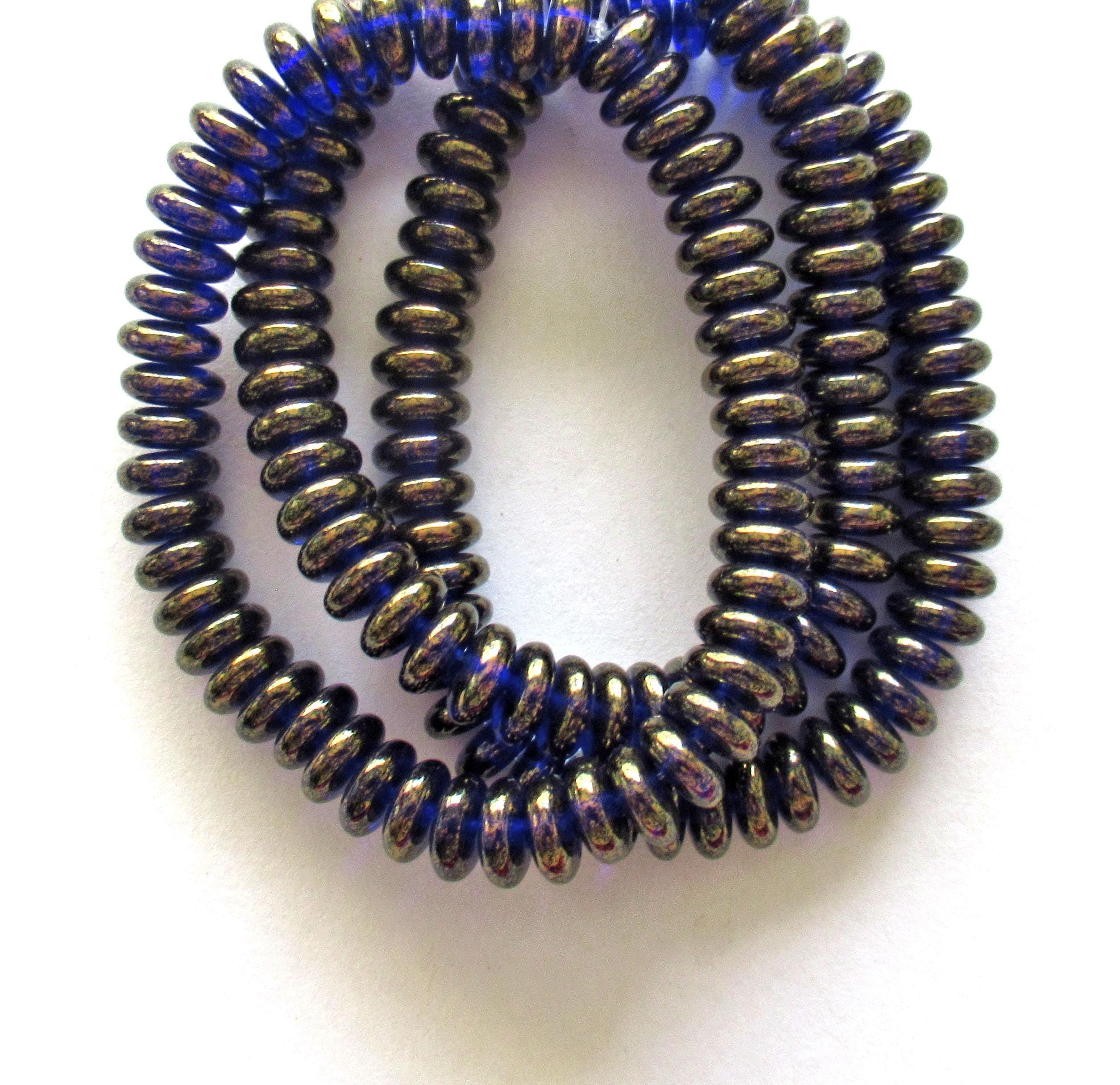 Lot of 50 6mm Czech glass rondelle spacer beads - transparent cobalt blue flat spacers with a bronze luster finish C00521