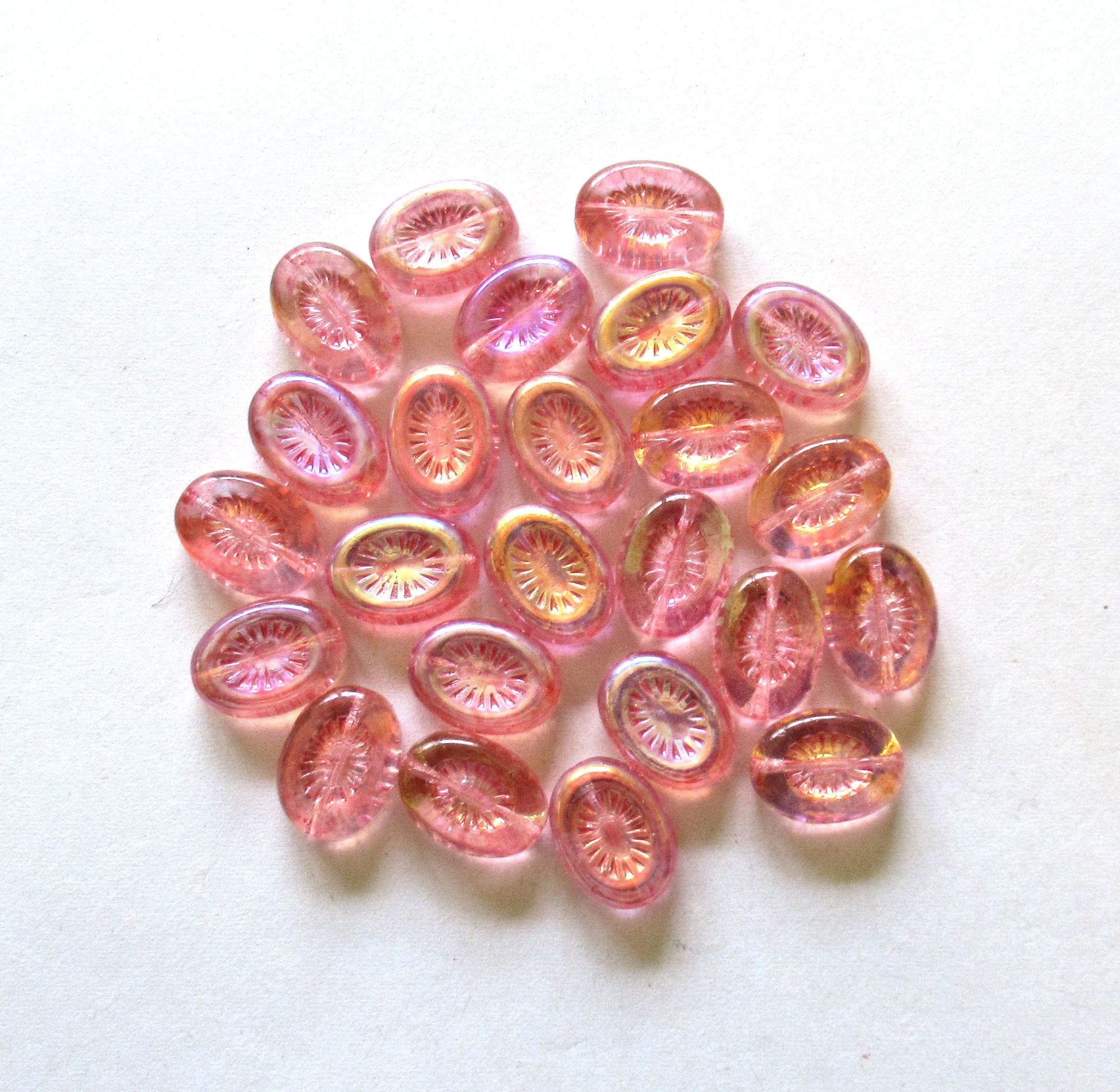 Ten Czech glass oval kiwi beads - 14 x 11mm - transparent pink with an AB finish on one side - C00361
