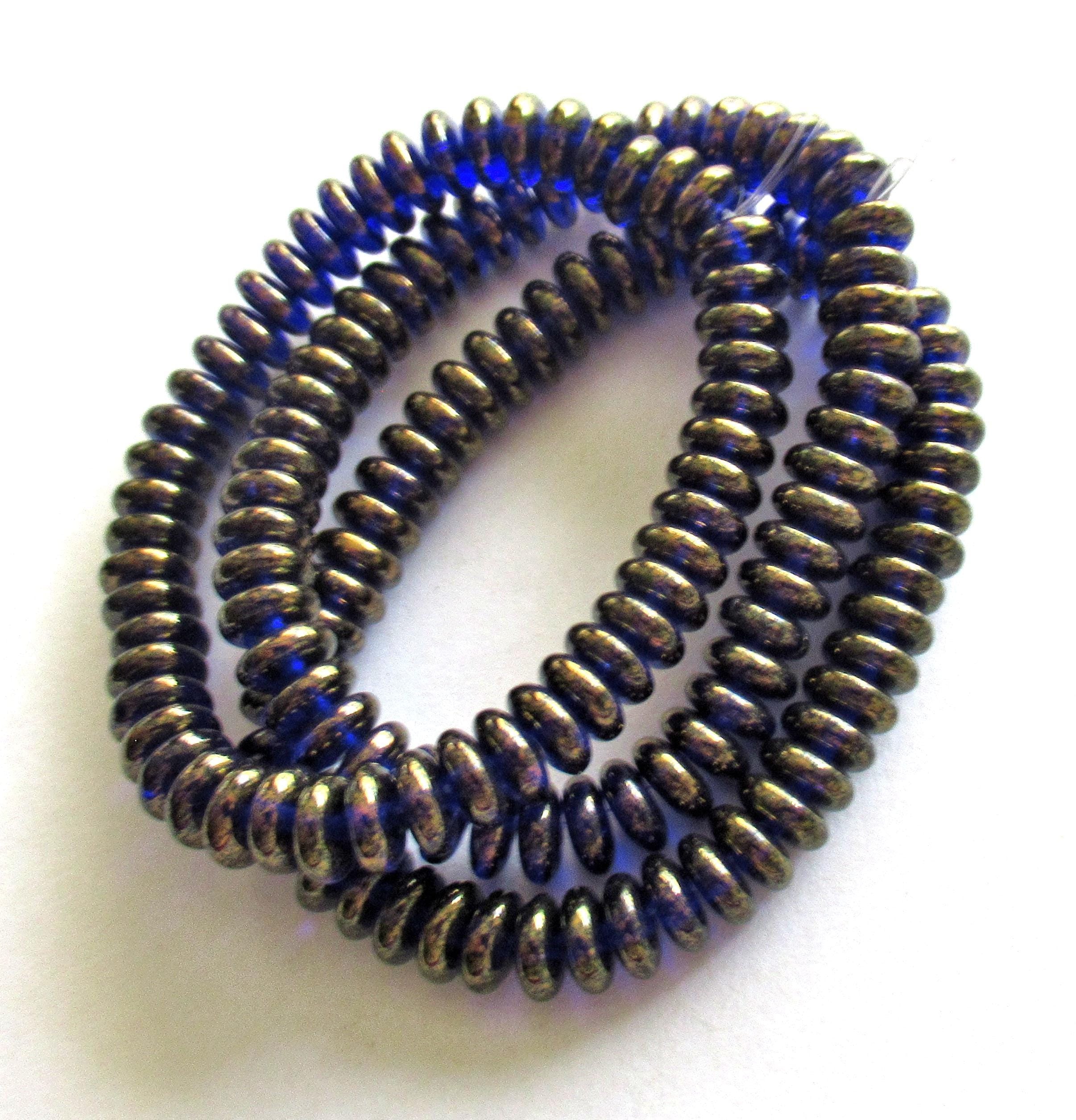 Lot of 50 6mm Czech glass rondelle spacer beads - transparent cobalt blue flat spacers with a bronze luster finish C00521