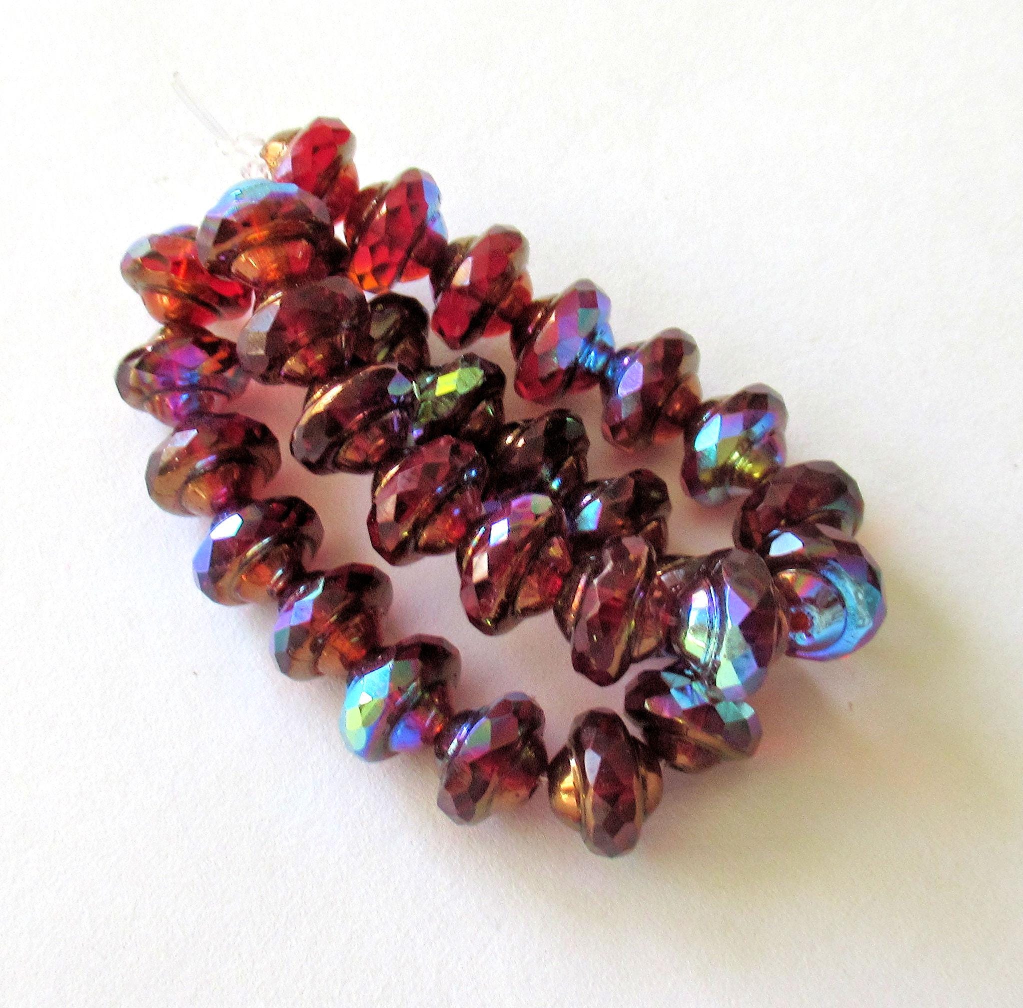 15 Czech glass mini faceted saturn or saucer beads - transparent red & orange w/ bronze and ab accents - 6 x 8mm - C00572