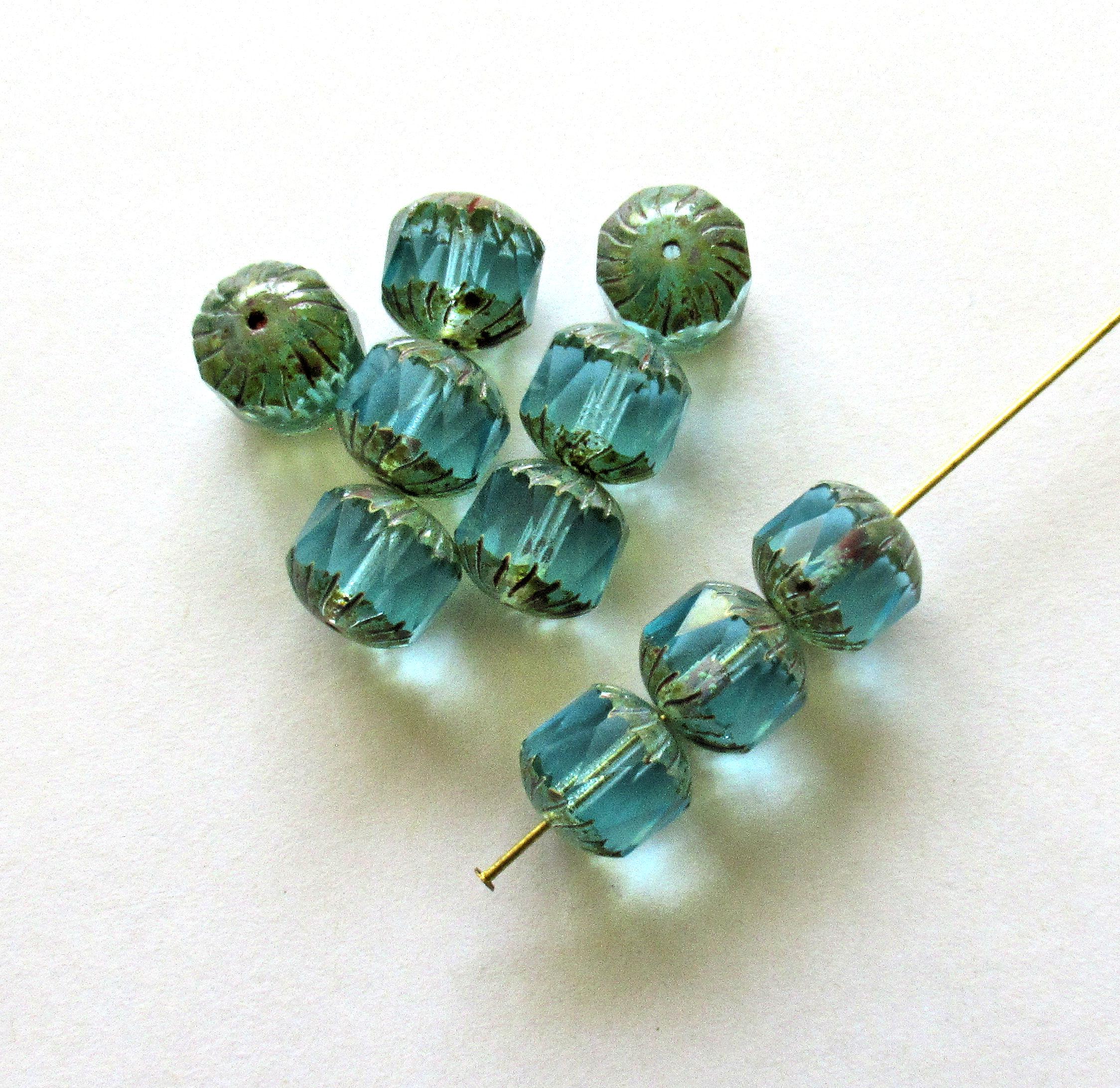 Ten Czech glass faceted carved cruller beads - 10mm - transparent aqua blue - cathedral beads w/ picasso accents on the ends - 00004