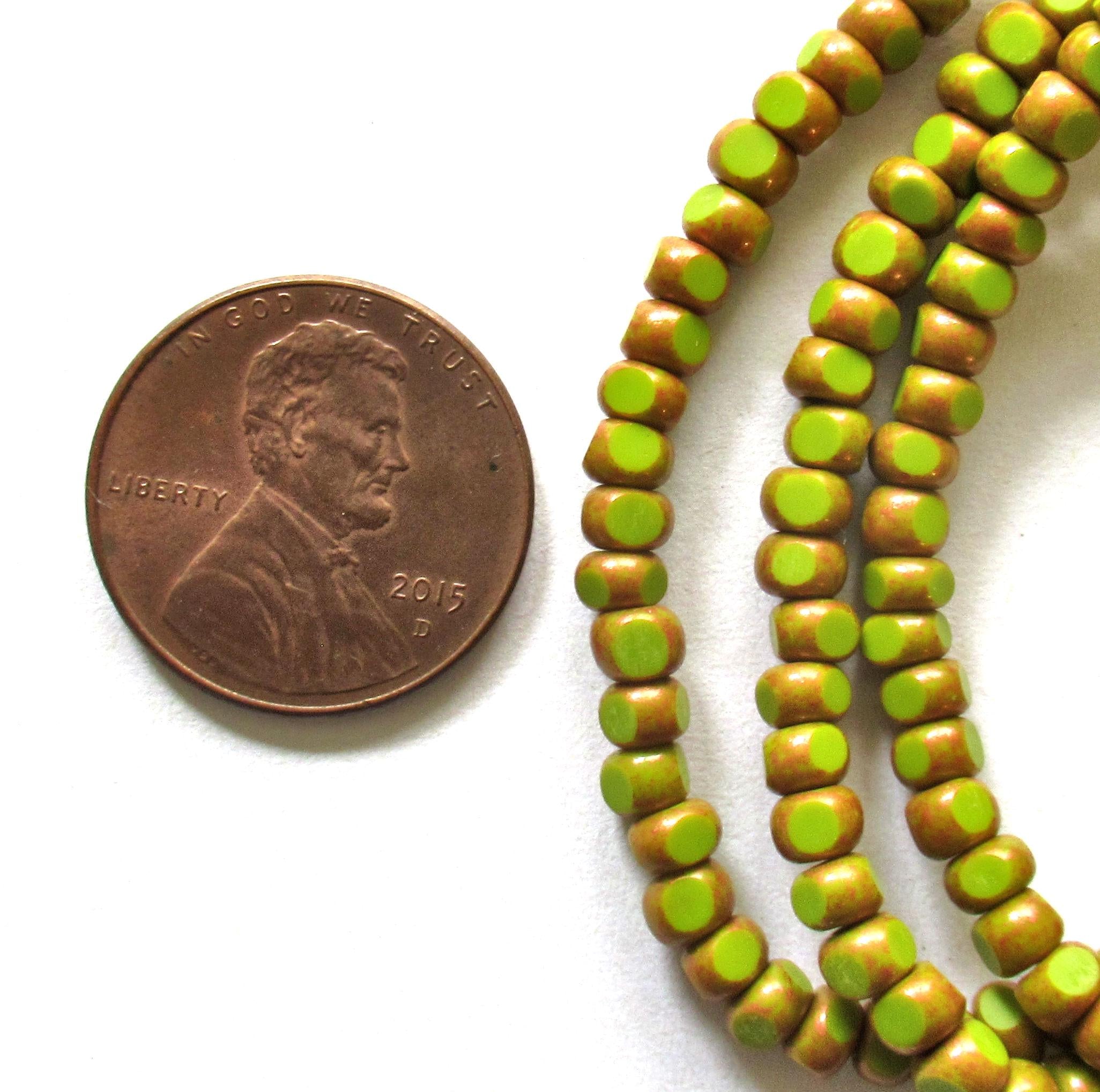 Fifty 6/0 tri cut faceted Czech glass seed beads -opaque avocado green with antique copper accents - C00141