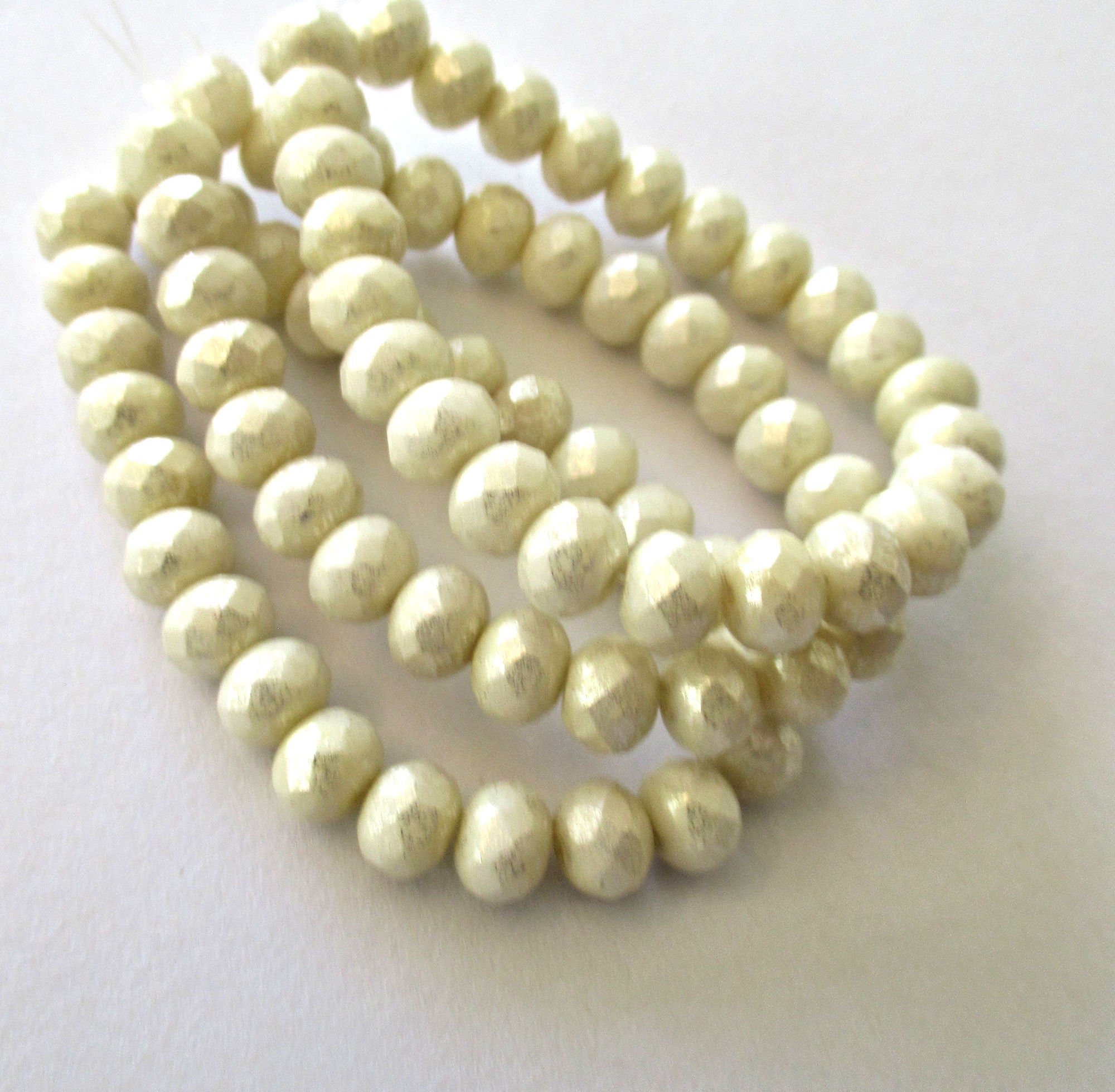 Lot of 25 Czech glass faceted puffy rondelle beads - 5 x 7mm opaque off white / ivory with a splotchy mercury finish - rondelles C00014