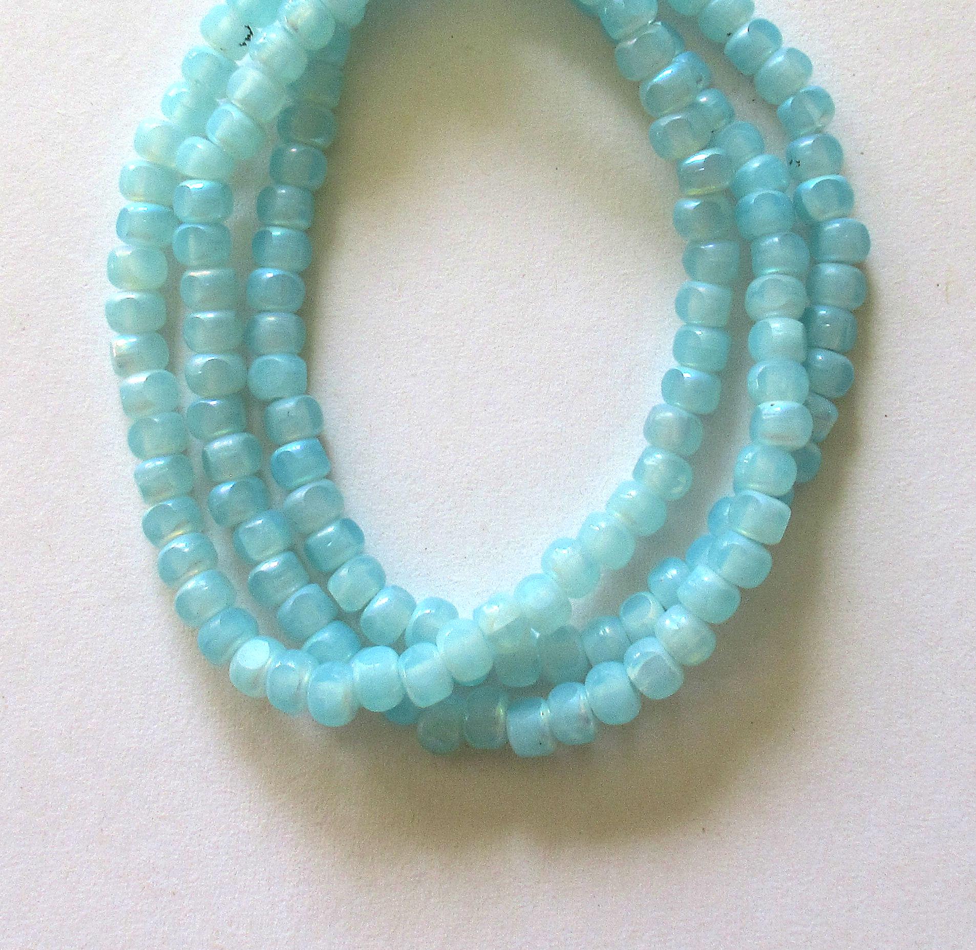 50 Czech glass 6/0 faceted seed beads - translucent baby blue with ab accents - 3 cut - tri-cut 4 x 3mm - C00611