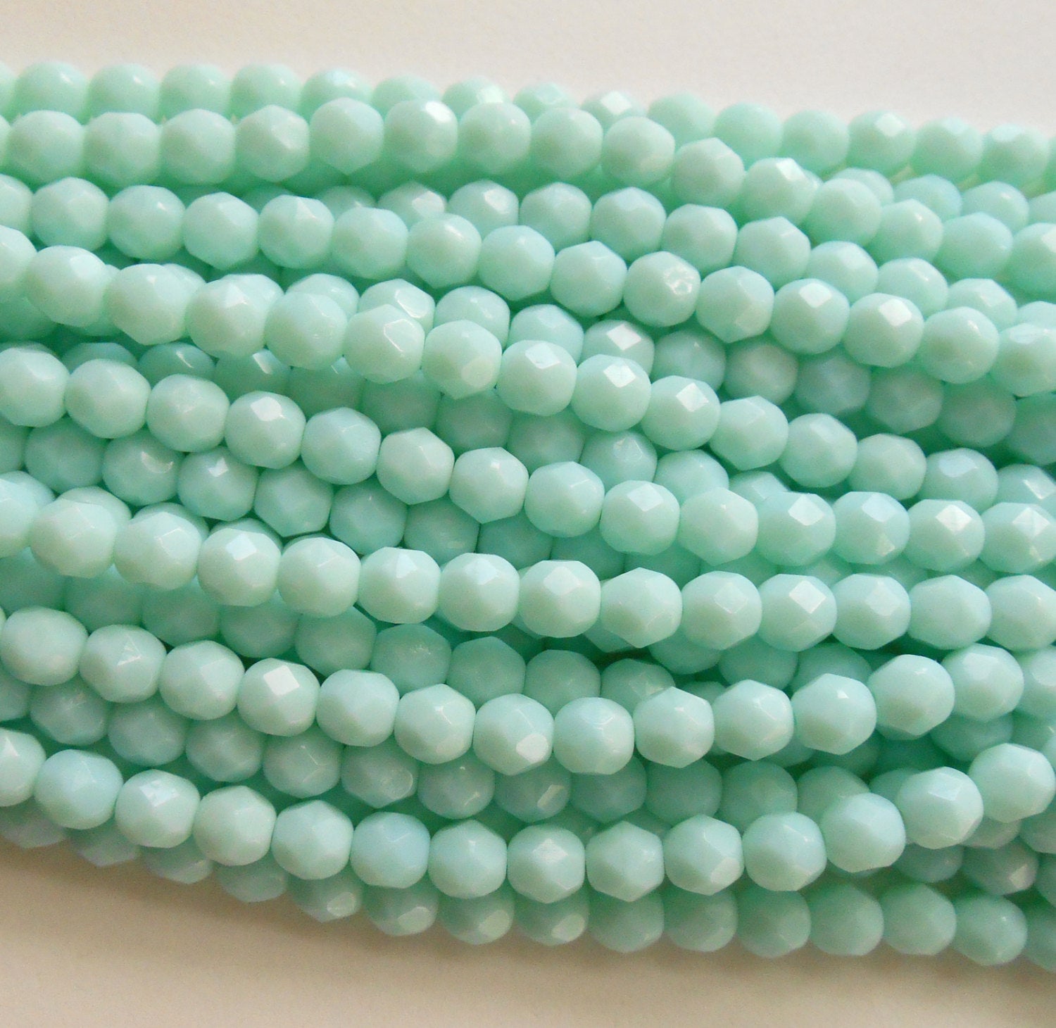 25 6mm Opaque Pale Jade Czech glass beads, minty geen, firepolished, faceted round beads, C7625 - Glorious Glass Beads
