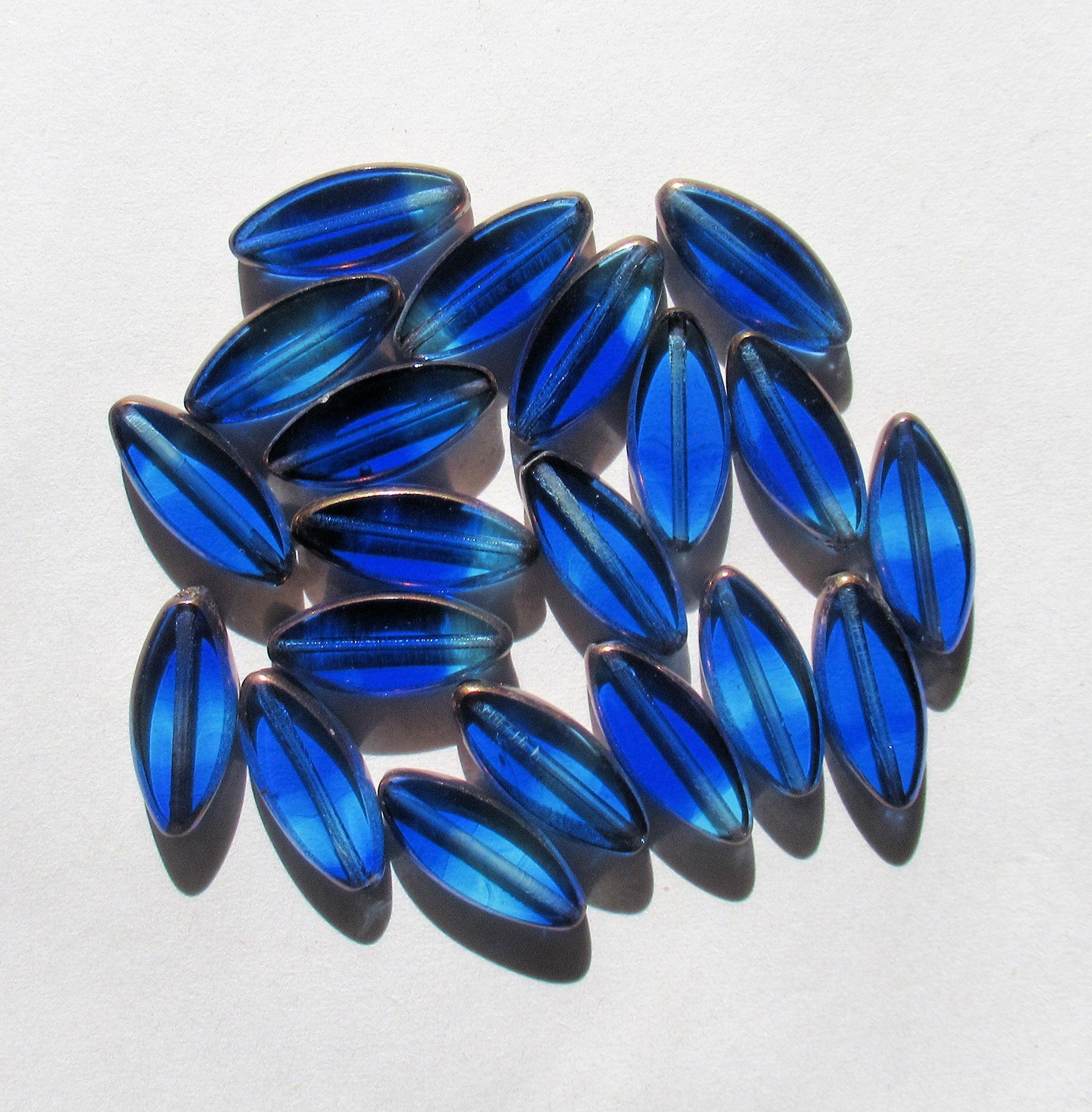 Ten Czech glass spindle beads - transparent marbled mix of sapphire and aqua blue - 18 x 7mm - table cut beads - C00012