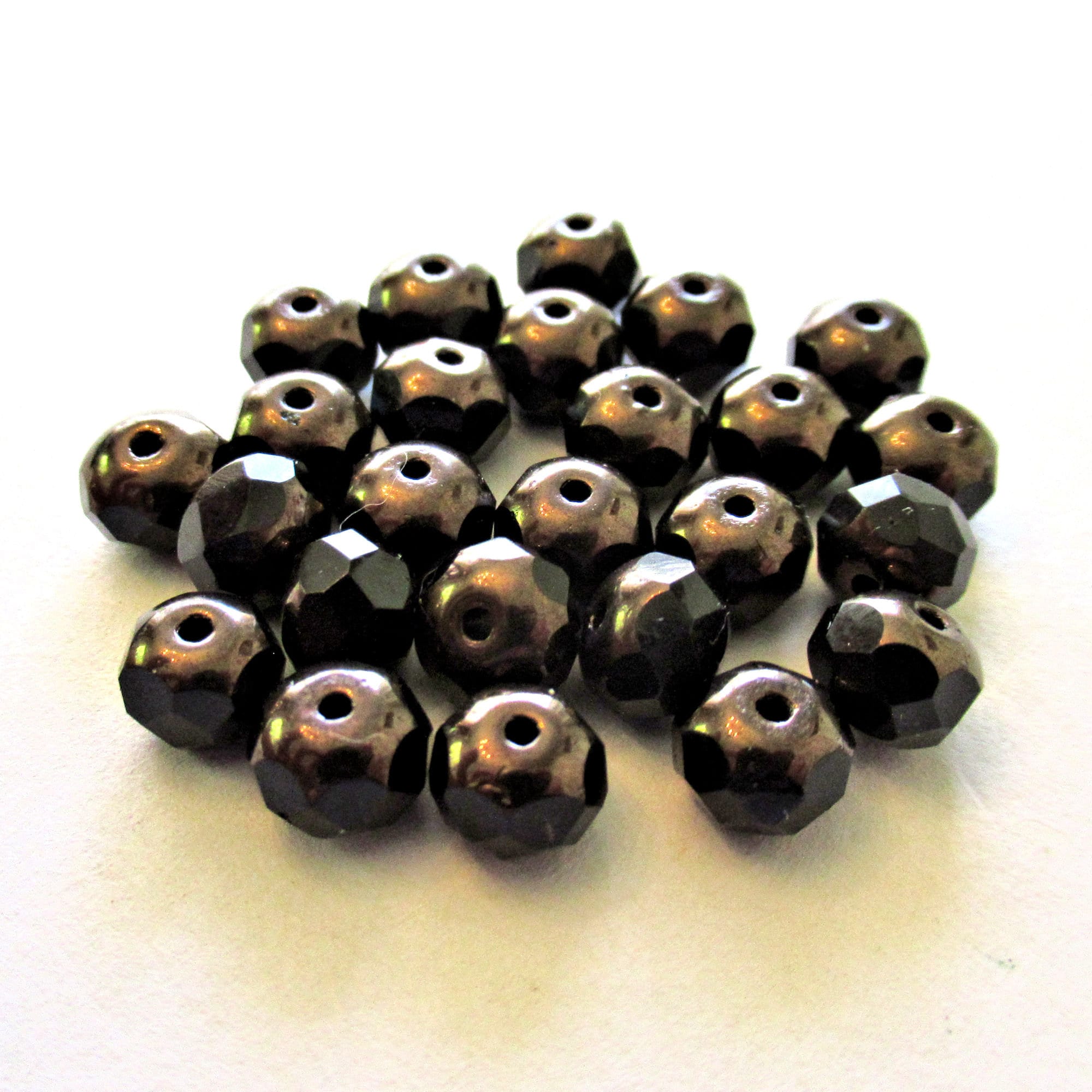25 Czech glass puffy rondelle or donut beads - 5 x 7mm jet black beads w/ bronze finish on the ends - fire polished faceted rondelles 00612