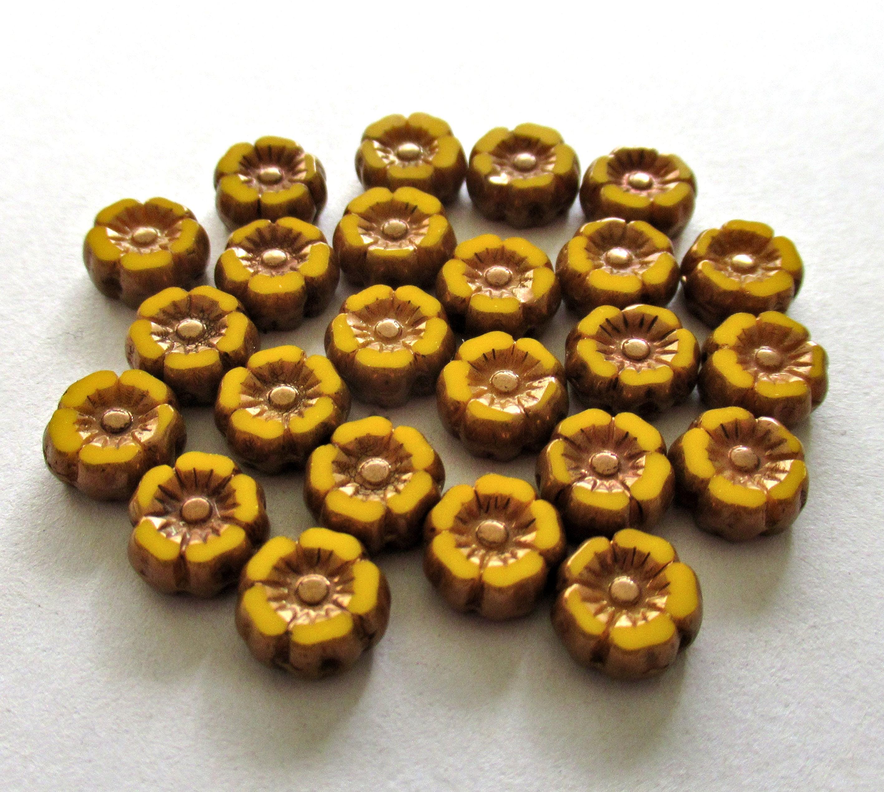 Lot of twelve 7mm Czech glass flower beads - orange yellow with bronze accents - table cut carved hibiscus Hawaiian floral beads - 00061