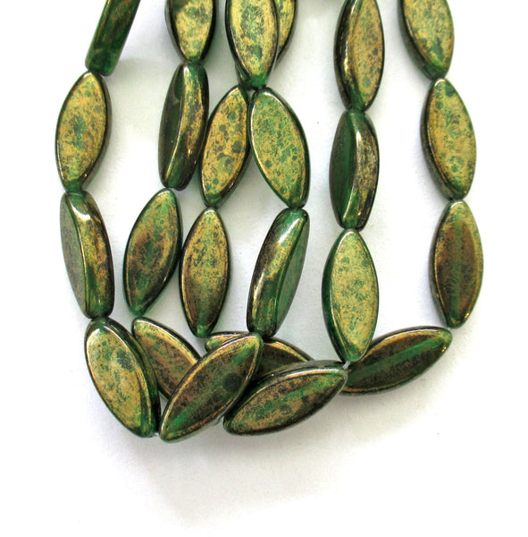 Ten Czech glass spindle beads - transparent emerald green w/ a splotchy bronze finish - 18 x 7mm table cut almond shaped beads C00191