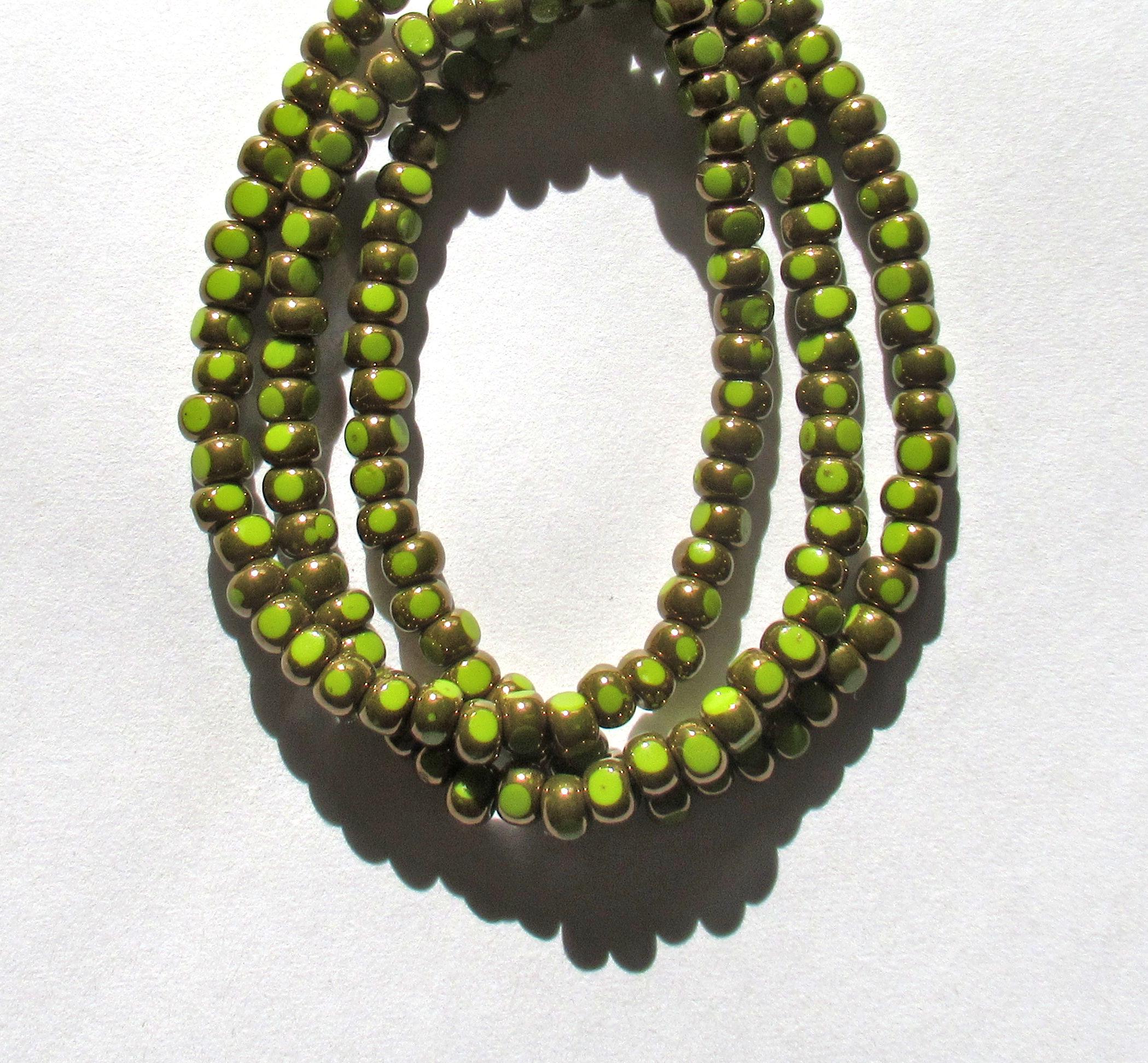 Fifty 6/0 tri cut faceted Czech glass seed beads -opaque avocado green with bronze accents - C00331