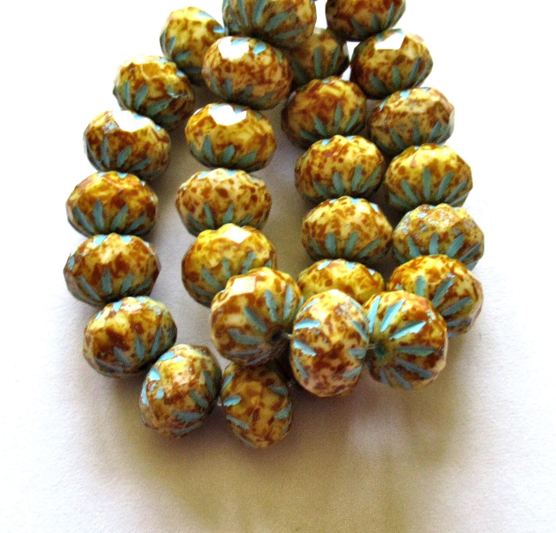 Ten Czech glass cruller beads - 7 x 10mm - off white w/ full picasso coat & blue wash - carved faceted rondelles - 00002