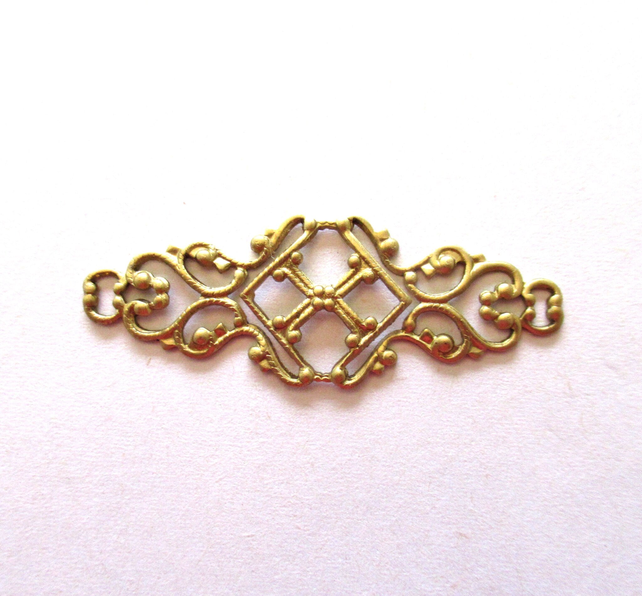 Four raw brass stampings - ornate Victorian connectors with rings - 1.75" x .75" inches USA made C00441