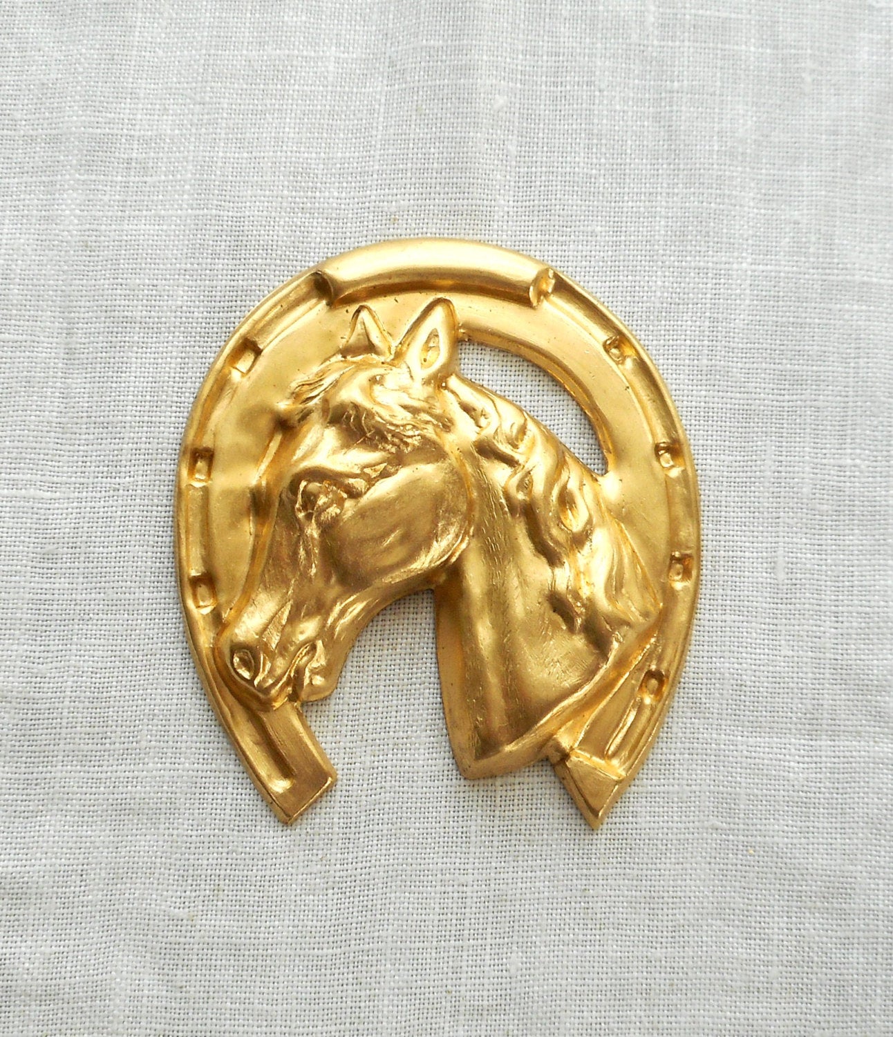1 large raw brass horse's head in a horse shoe, pendant, charm, brass stamping, ornament 1.625" in by 1.625" in. made in the USA 4401 - Glorious Glass Beads