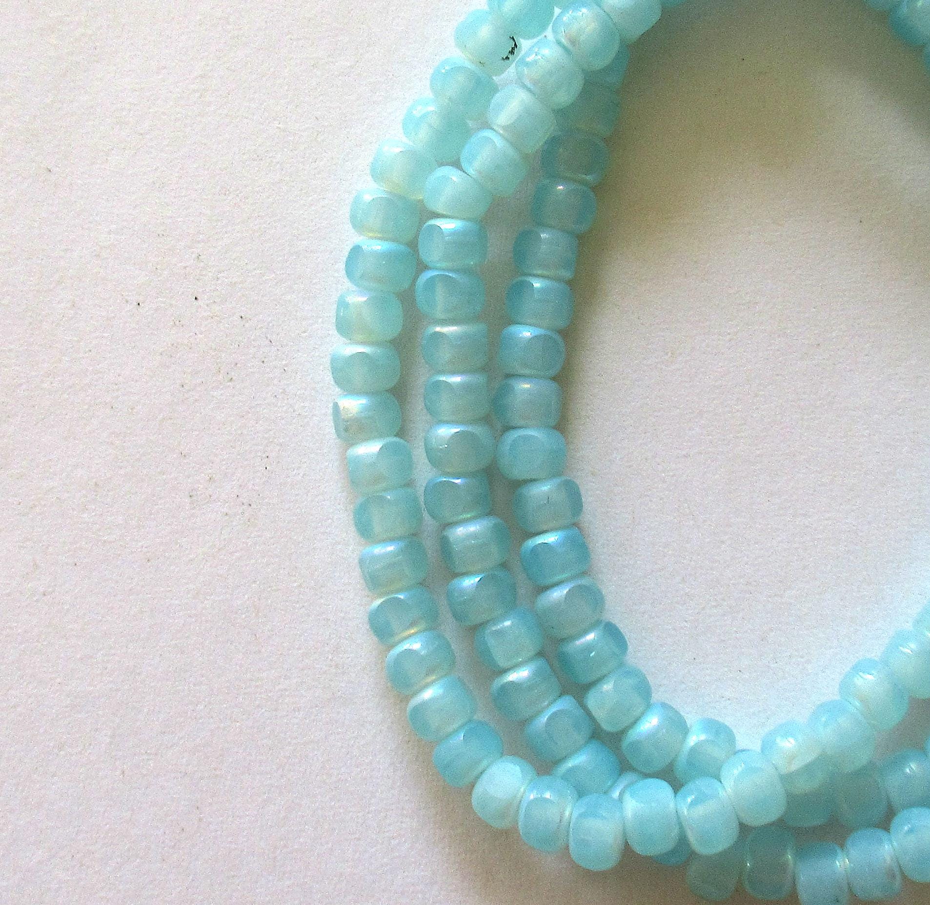 50 Czech glass 6/0 faceted seed beads - translucent baby blue with ab accents - 3 cut - tri-cut 4 x 3mm - C00611