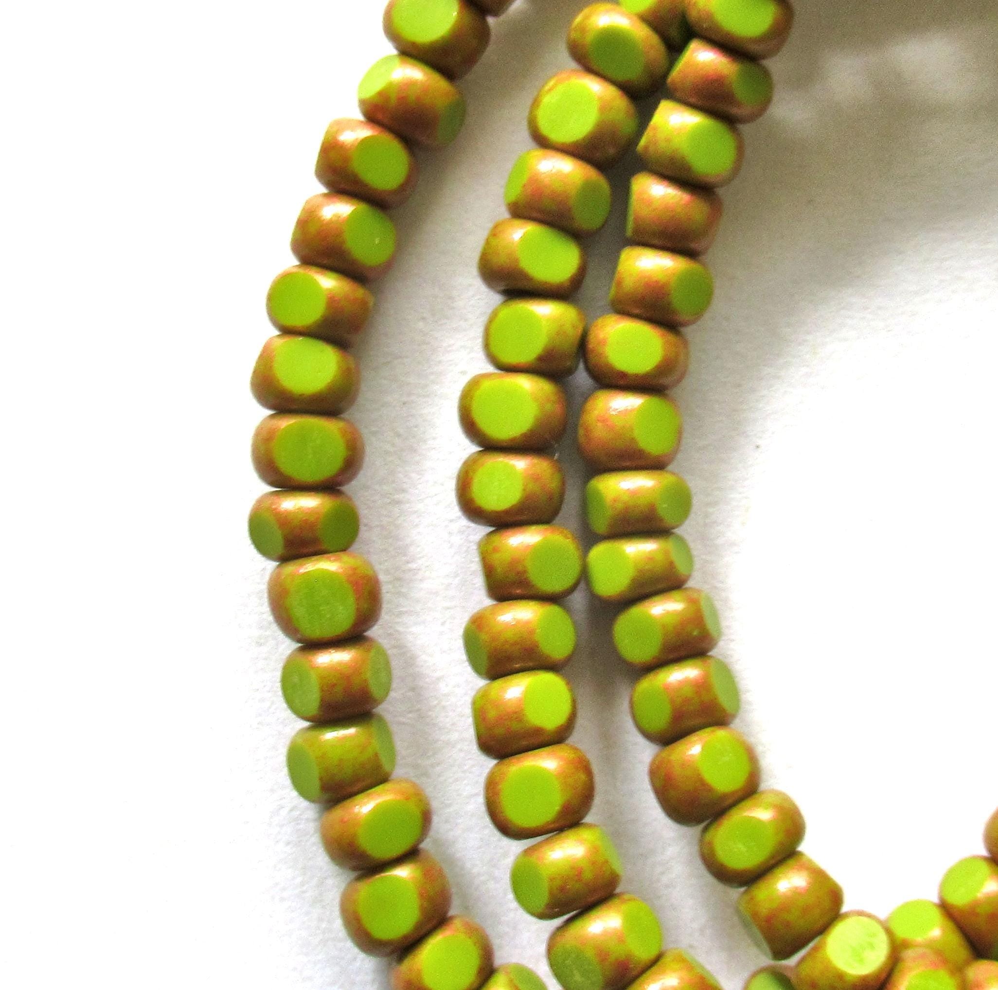 Fifty 6/0 tri cut faceted Czech glass seed beads -opaque avocado green with antique copper accents - C00141