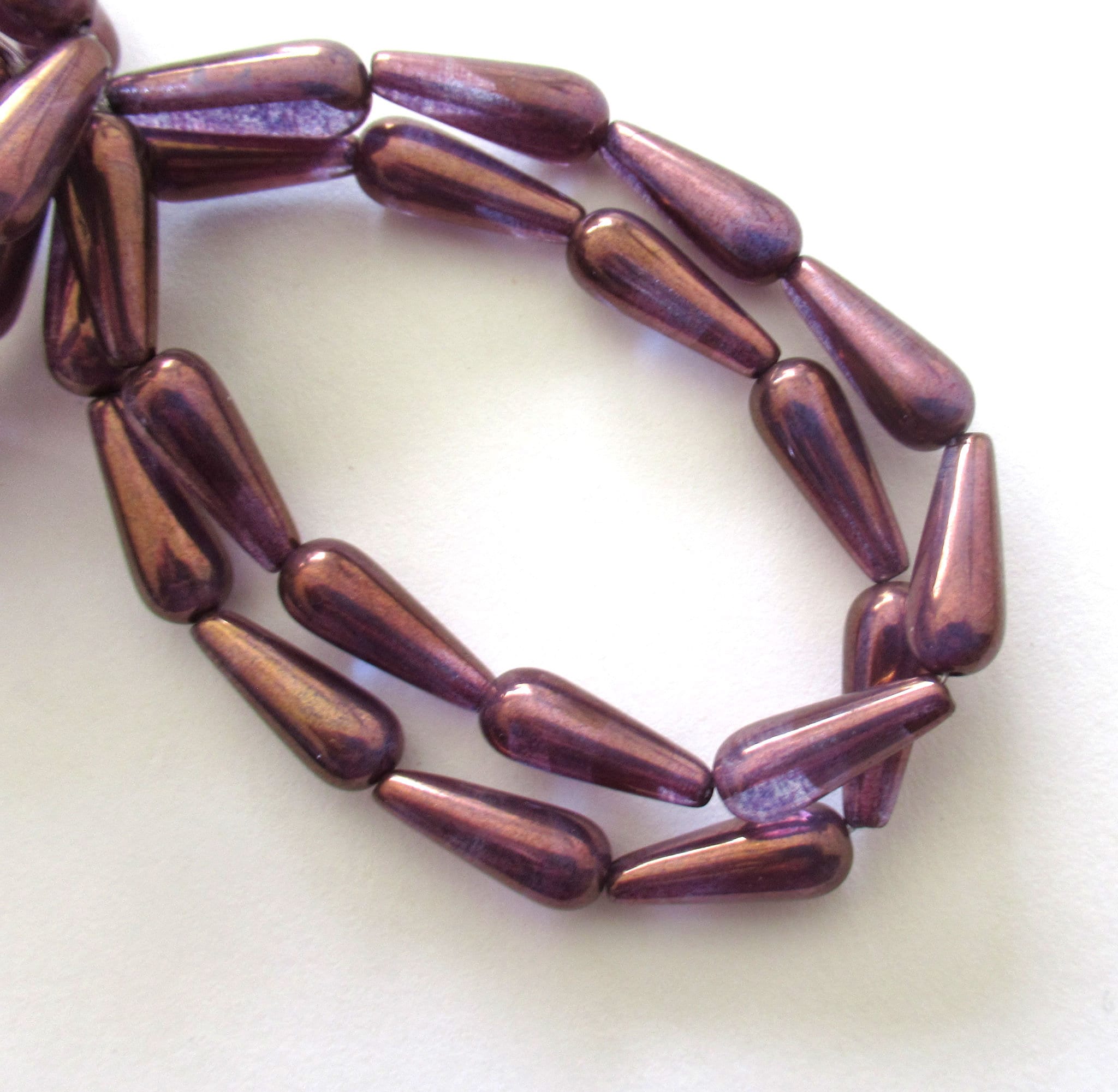 Ten Czech glass teardrop beads - amethyst / purple with a bronze finish - 6 x 15mm elongated tear drops 00311