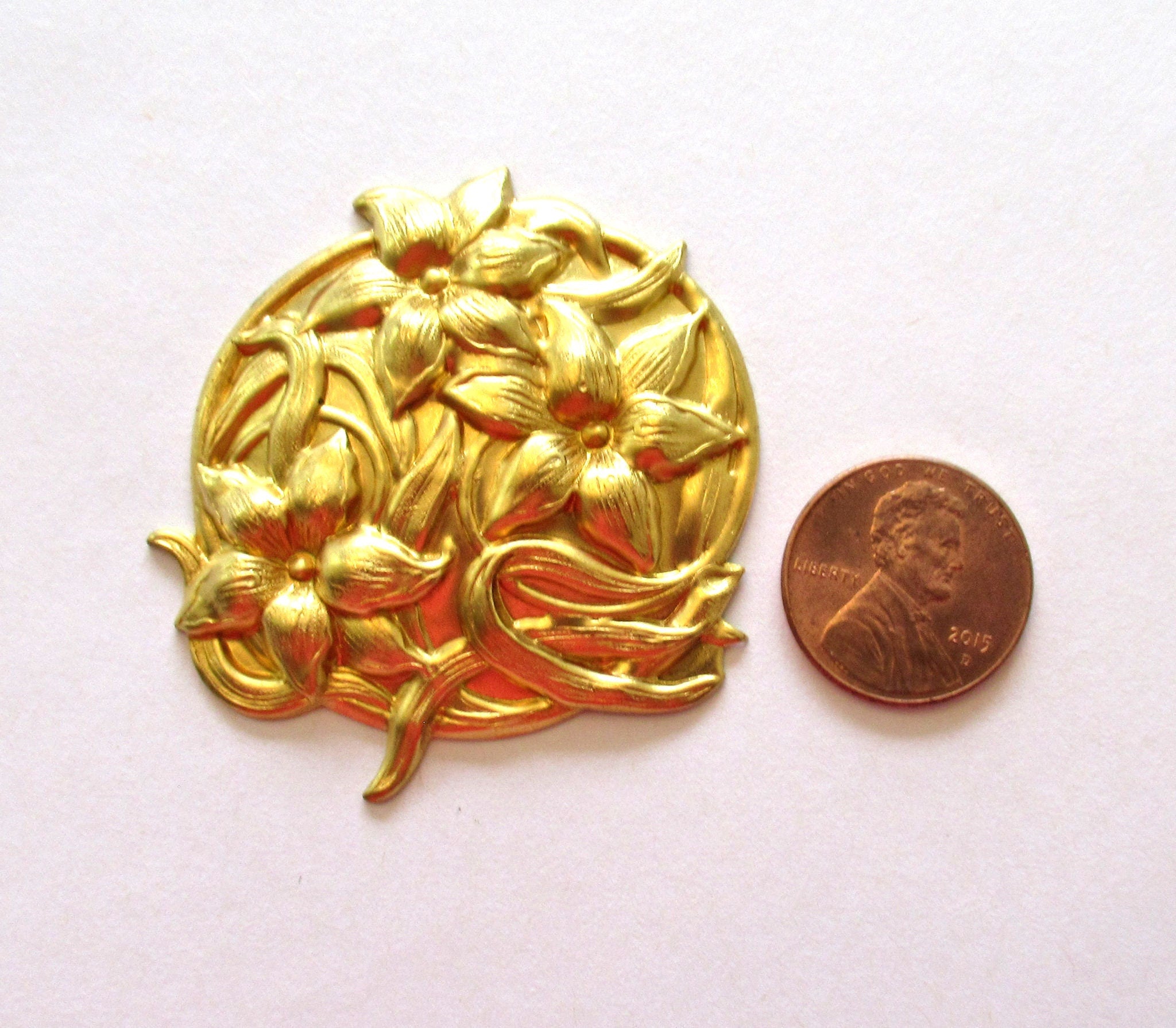 One raw brass floral medallion - stylized Victorian flower pendant -ornament - brass stamping - 2 inches in diameter- made in USA C0095