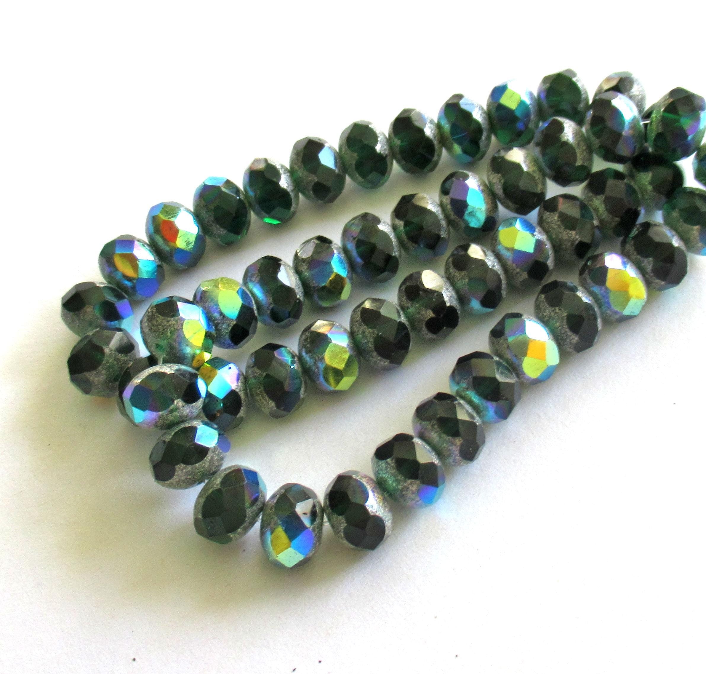 25 Czech glass puffy rondelle beads - 8 x 6mm - transparent dark emerald or forest green w/ silver & ab accents - 00362
