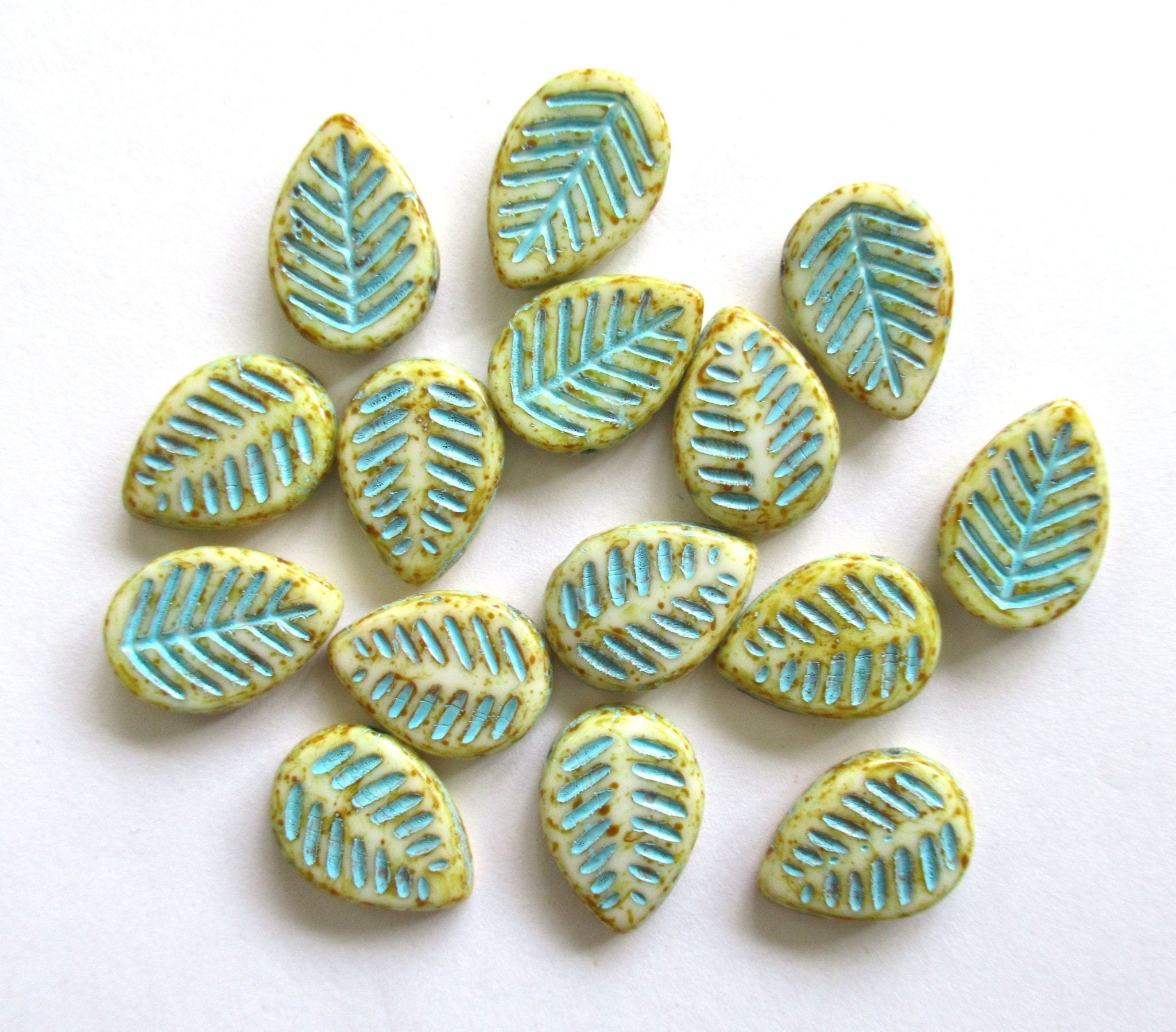 Ten large Czech glass leaf beads - side drilled off white beads with a turquoise wash and picasso finish - 12 x 16mm carved beads C00021