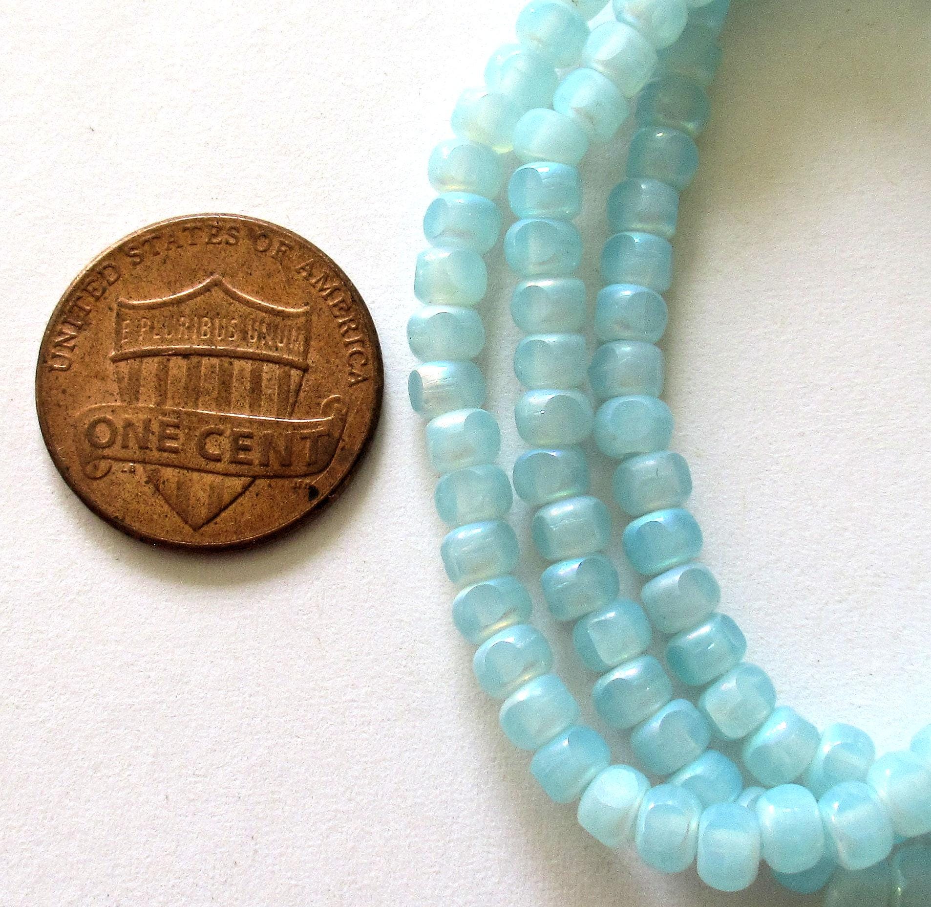 50 Czech glass 6/0 faceted seed beads - translucent baby blue with ab accents - 3 cut - tri-cut 4 x 3mm - C00611