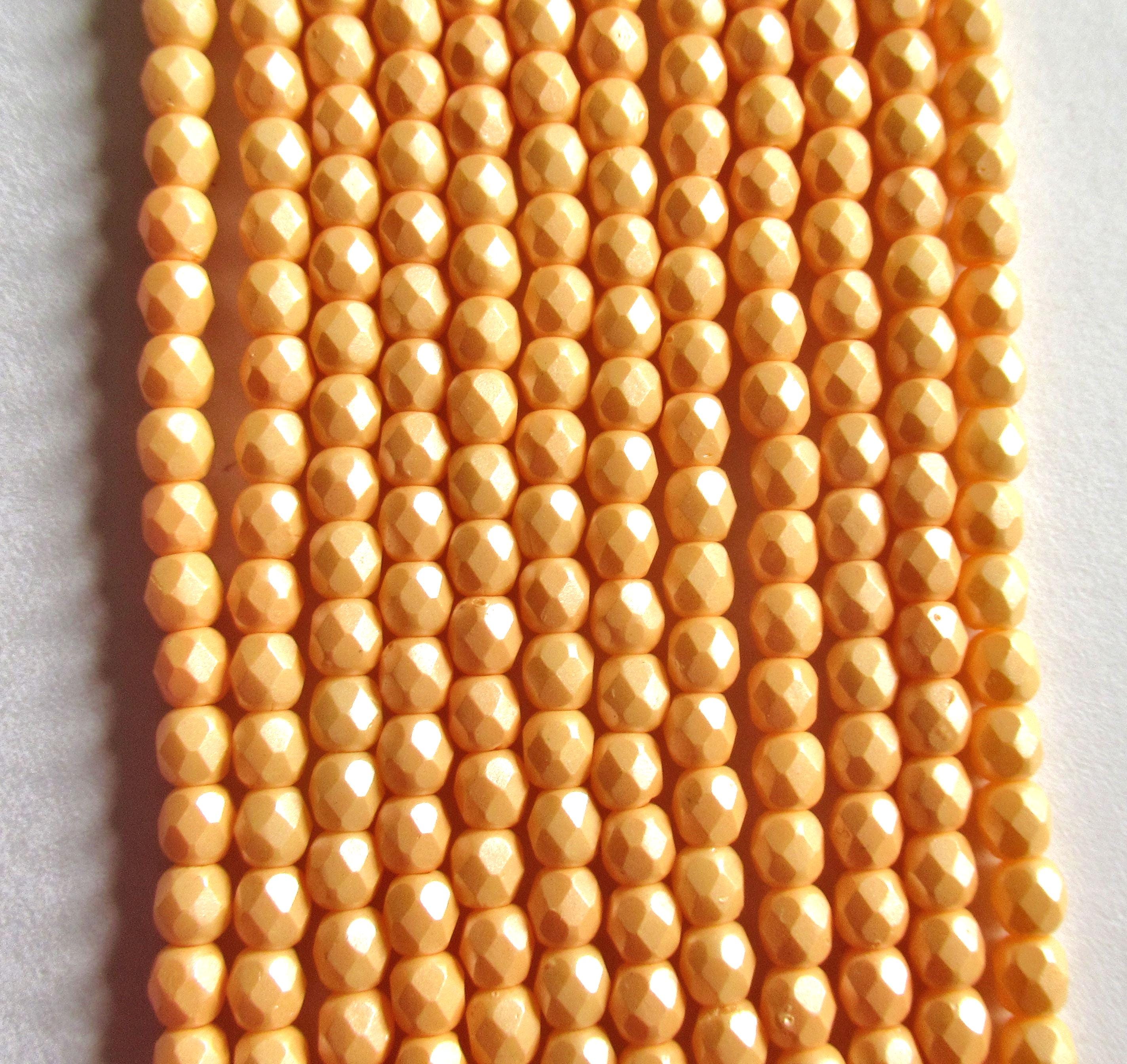 50 4mm Czech glass beads - powdery pastel orange -faceted round beads - C0018