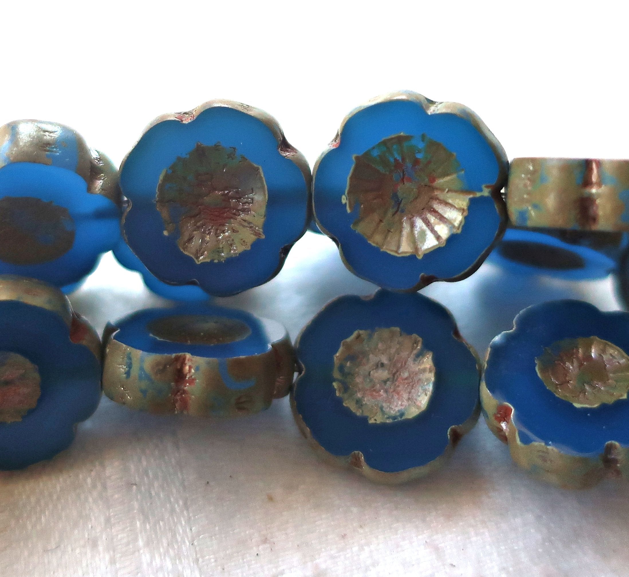 Six 14mm Czech glass flower beads. table cut, carved, translucent capri blue with a picasso finish, Hawaiian flowers C02101