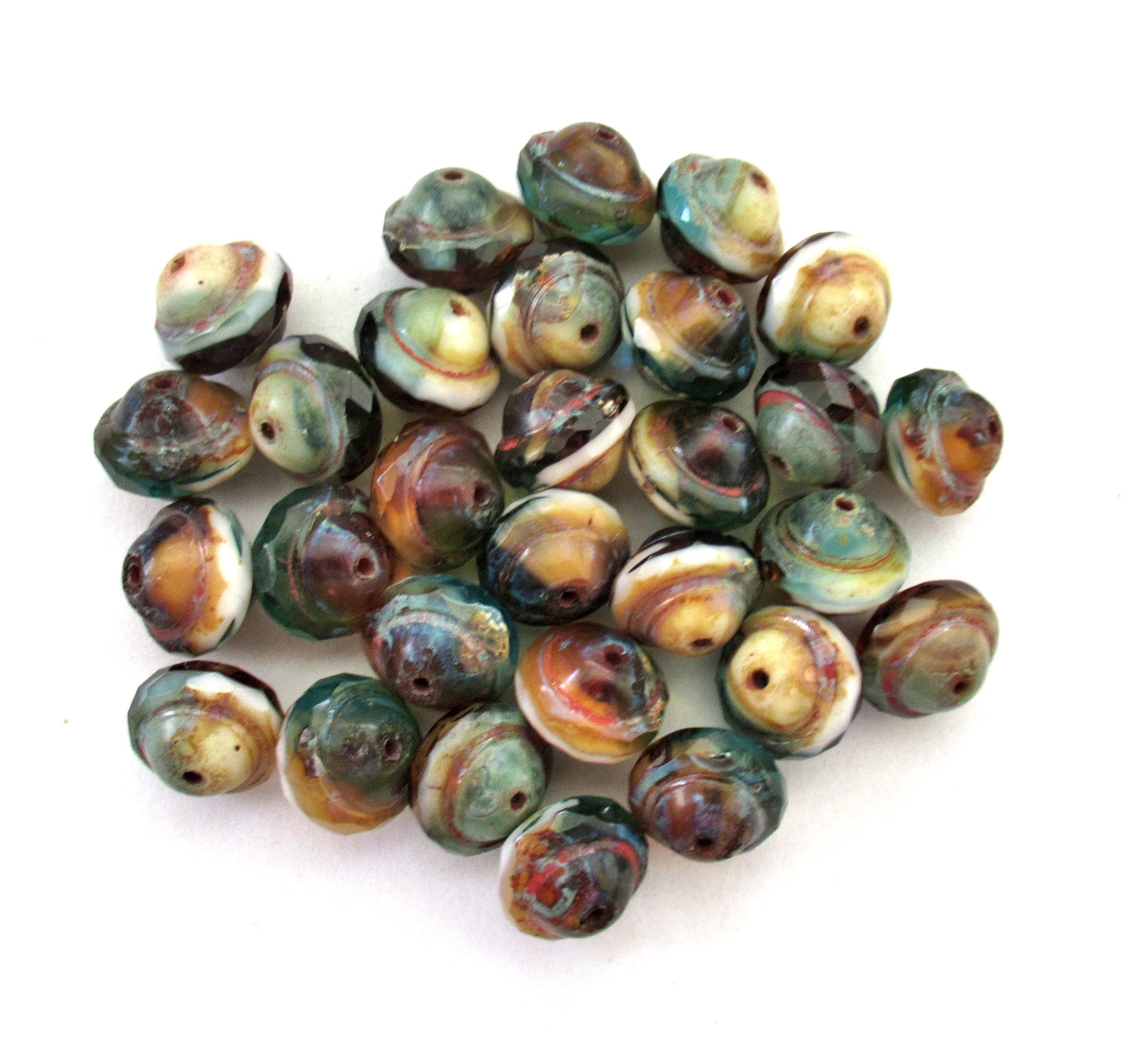 Fifteen Czech glass faceted saturn / saucer beads - 8 x 10mm - amber / blue green & white marbled mix with a picasso accents - C00302