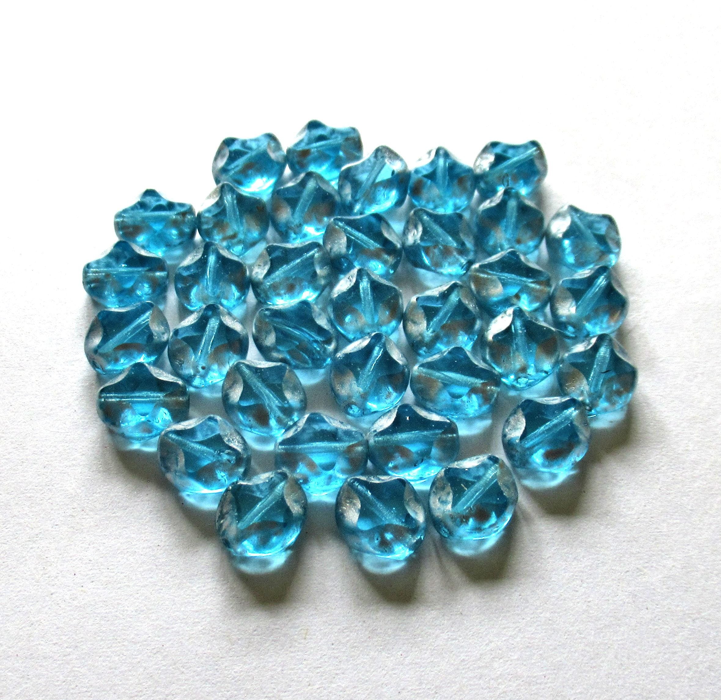 10 Czech glass oval beads - 9 x 8mm - aqua blue w/ silver picasso accents - carved table cut beads with a diamond pattern - C0121