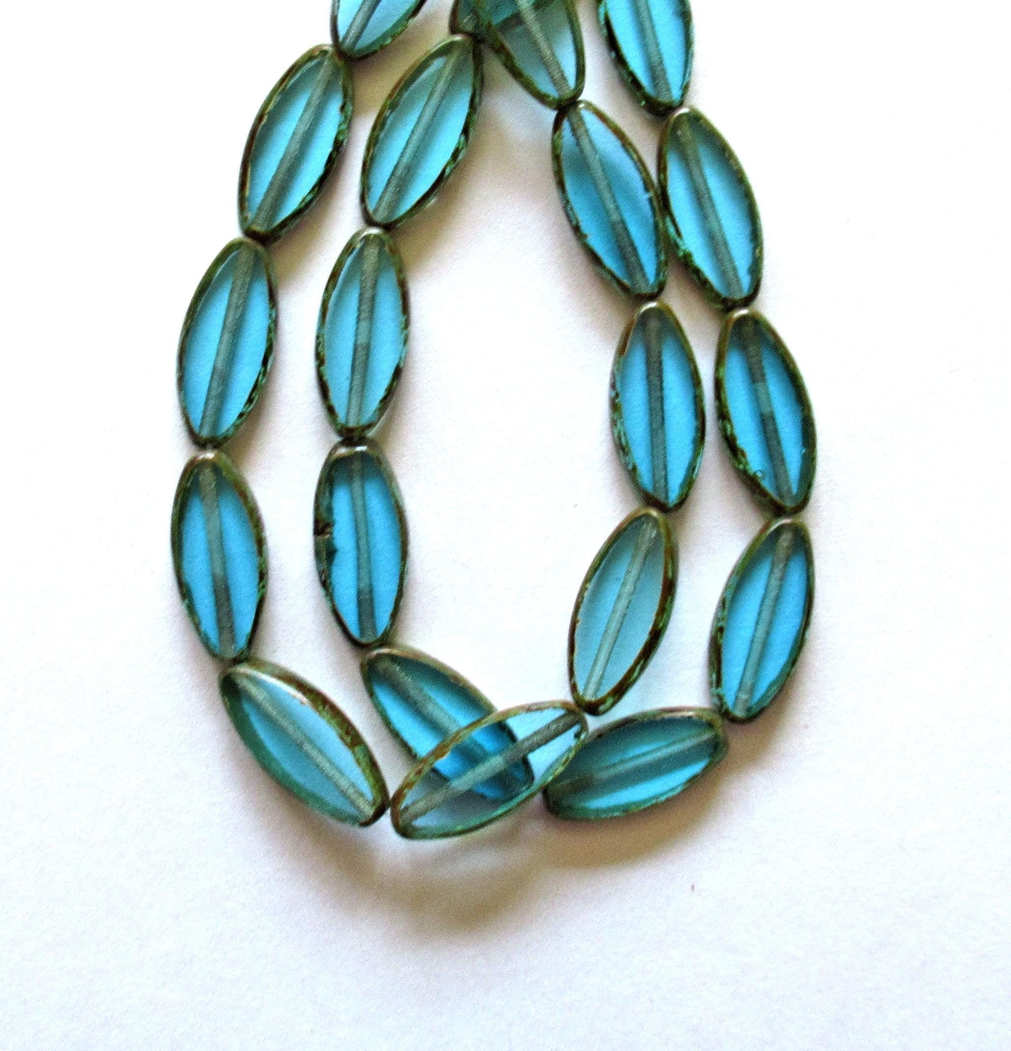 Ten Czech glass spindle beads - transparent aqua blue - 18 x 7mm - table cut beads - C00052