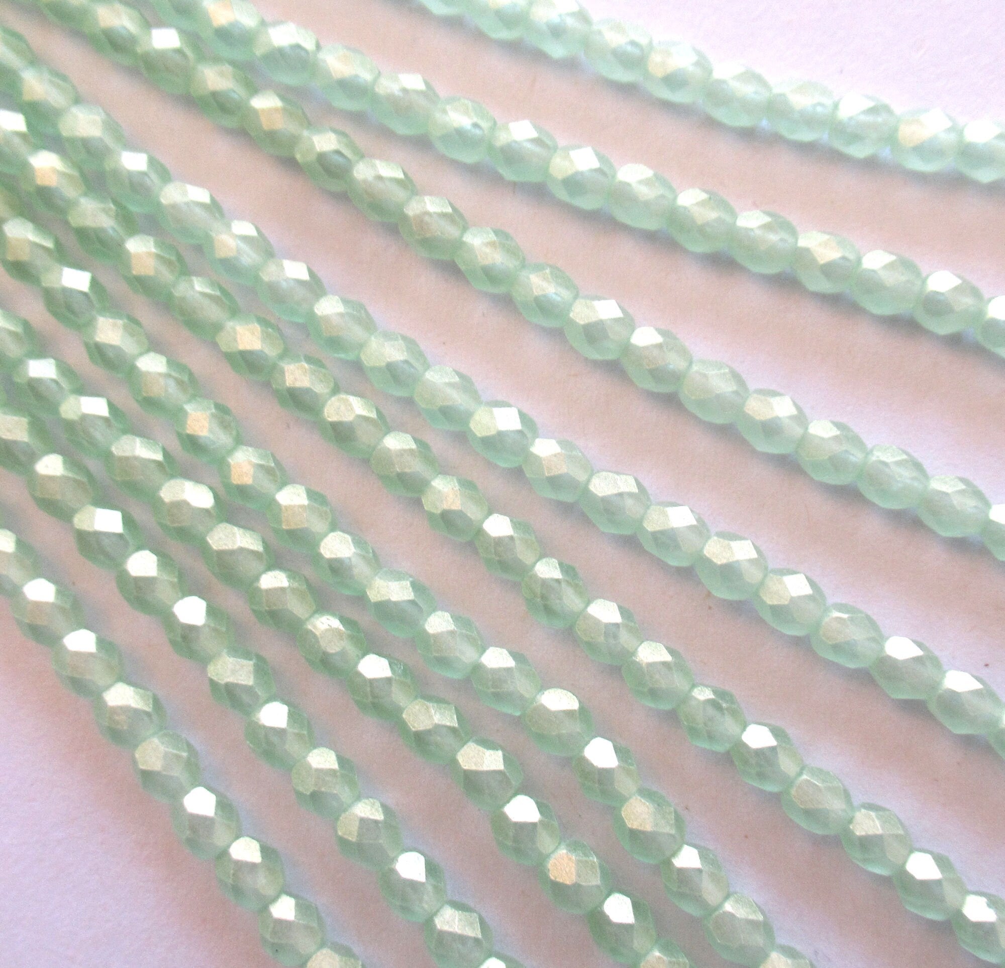50 4mm faceted Czech glass round beads - Sueded Gold Peirdot - light green with a gold finish fire polished beads - C0024
