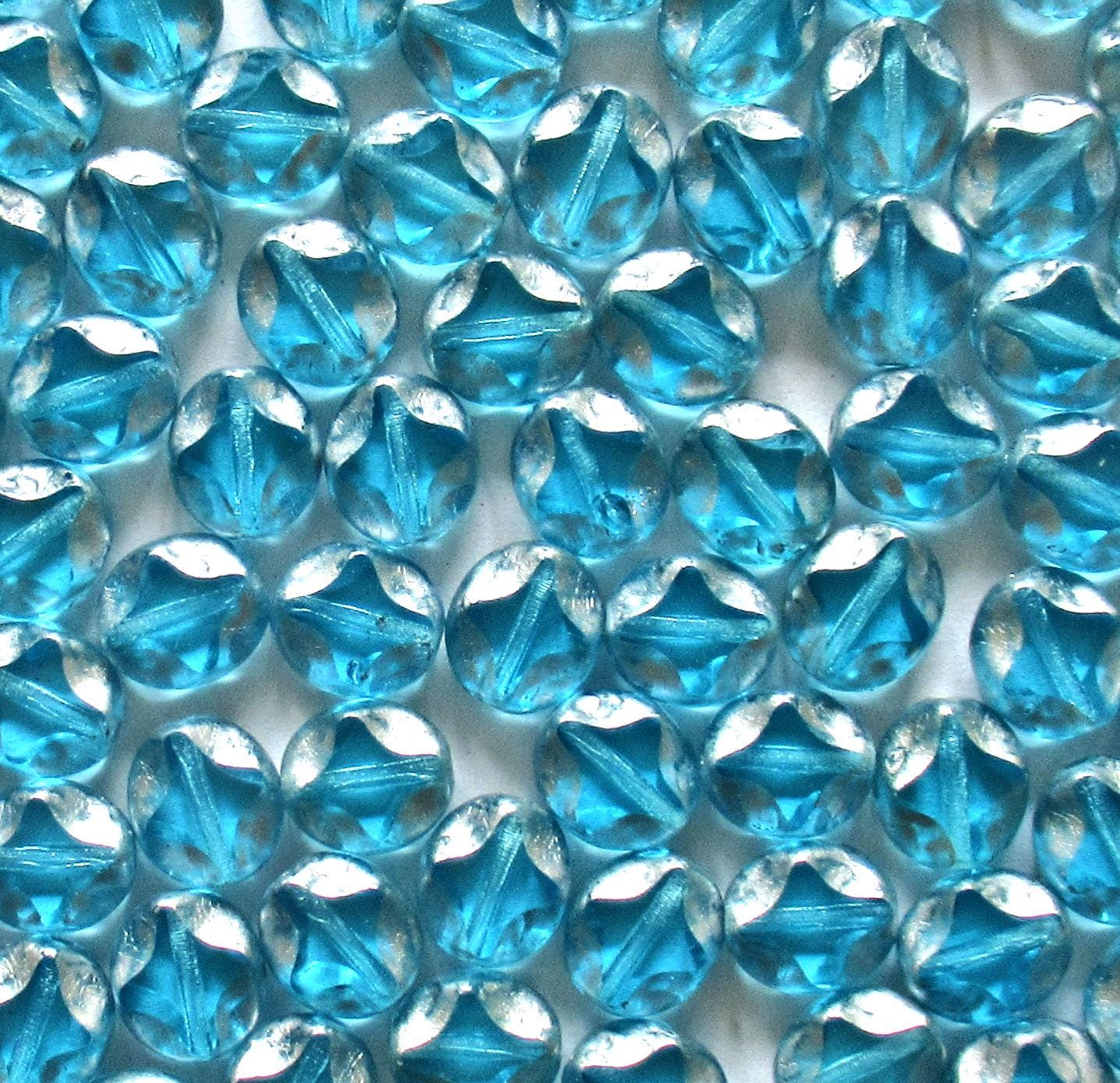 10 Czech glass oval beads - 9 x 8mm - aqua blue w/ silver picasso accents - carved table cut beads with a diamond pattern - C0121