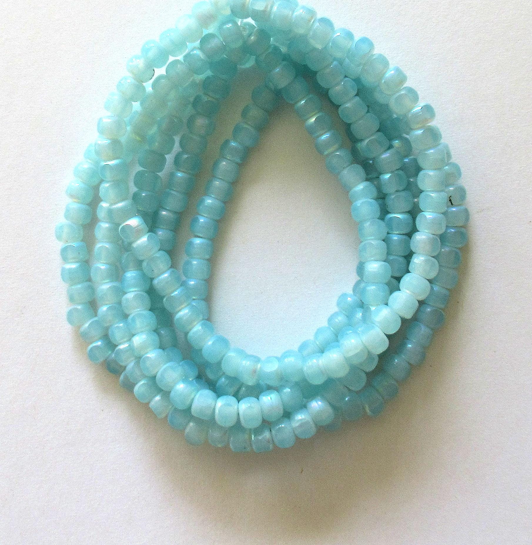 50 Czech glass 6/0 faceted seed beads - translucent baby blue with ab accents - 3 cut - tri-cut 4 x 3mm - C00611