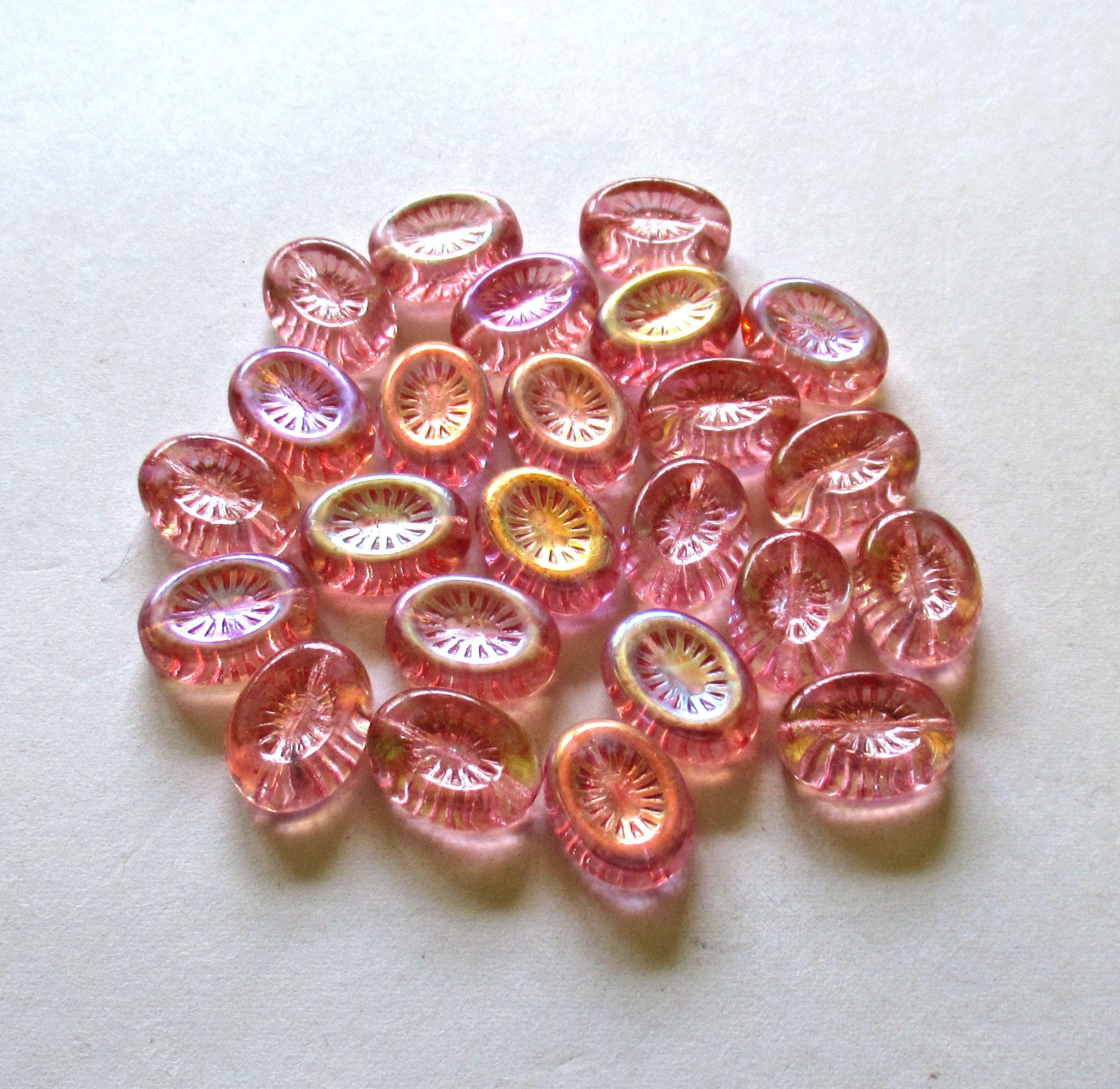 Ten Czech glass oval kiwi beads - 14 x 11mm - transparent pink with an AB finish on one side - C00361