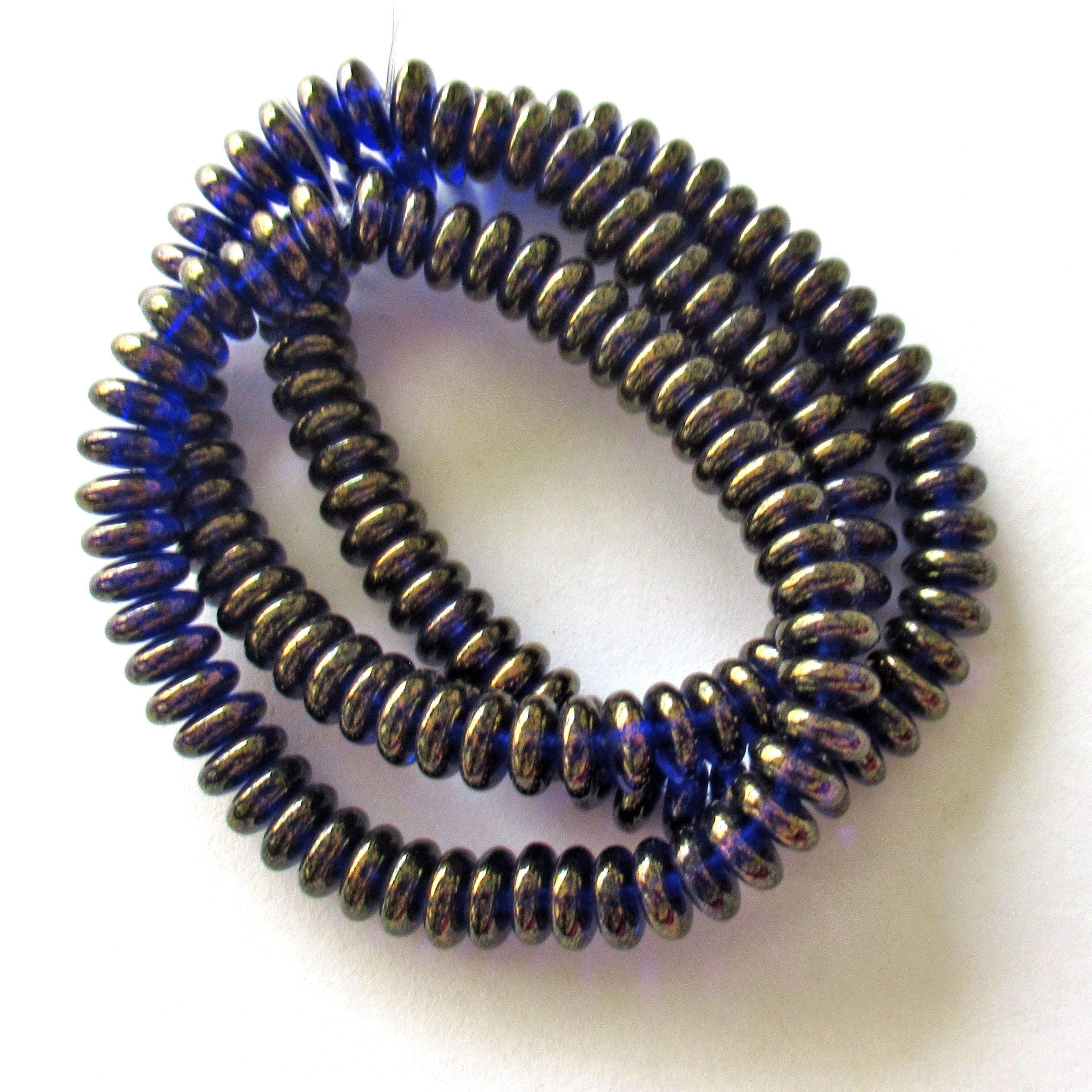 Lot of 50 6mm Czech glass rondelle spacer beads - transparent cobalt blue flat spacers with a bronze luster finish C00521