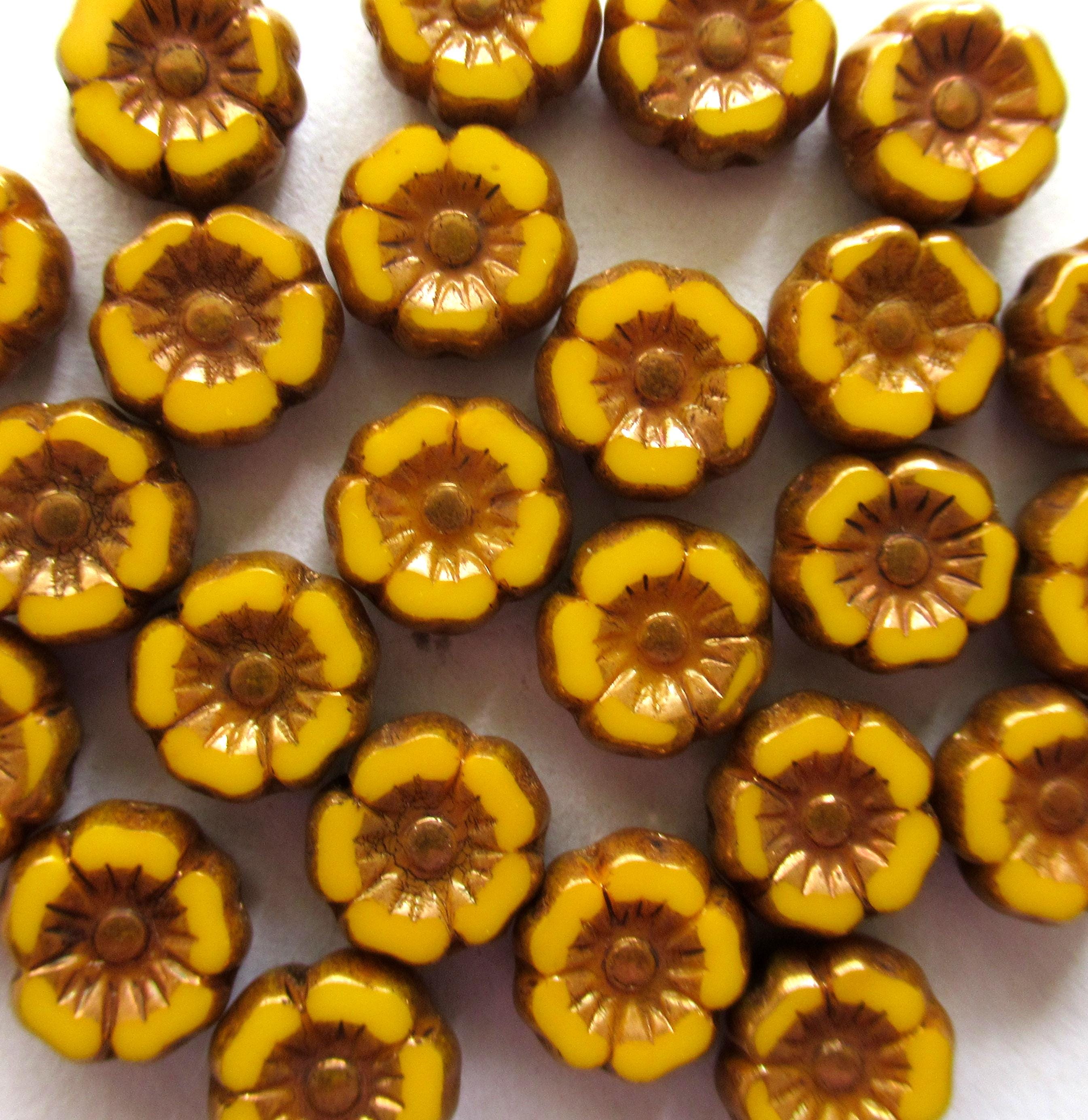 Lot of twelve 7mm Czech glass flower beads - orange yellow with bronze accents - table cut carved hibiscus Hawaiian floral beads - 00061