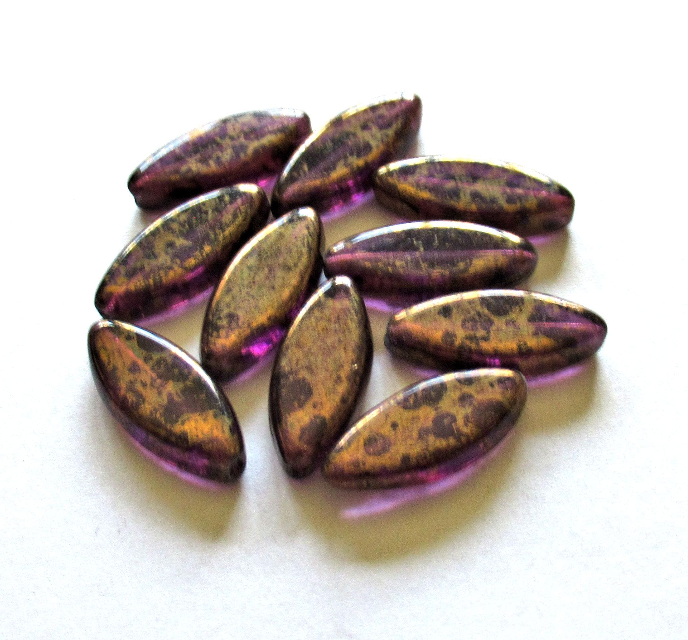 Ten Czech glass spindle beads - 18mm x 7mm - amethyst or purple with a splotchy bronze finish - table cut beads C00522