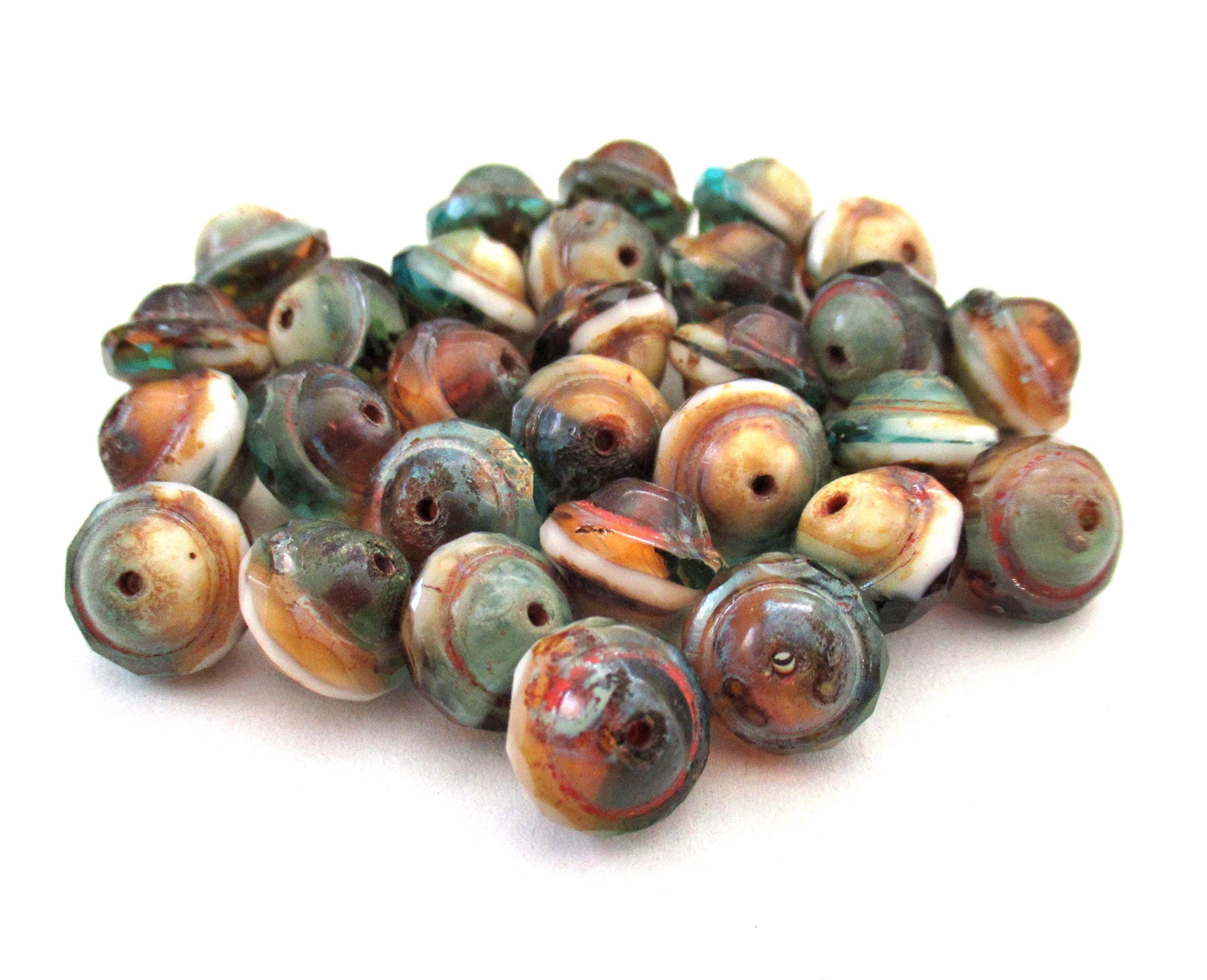 Fifteen Czech glass faceted saturn / saucer beads - 8 x 10mm - amber / blue green & white marbled mix with a picasso accents - C00302