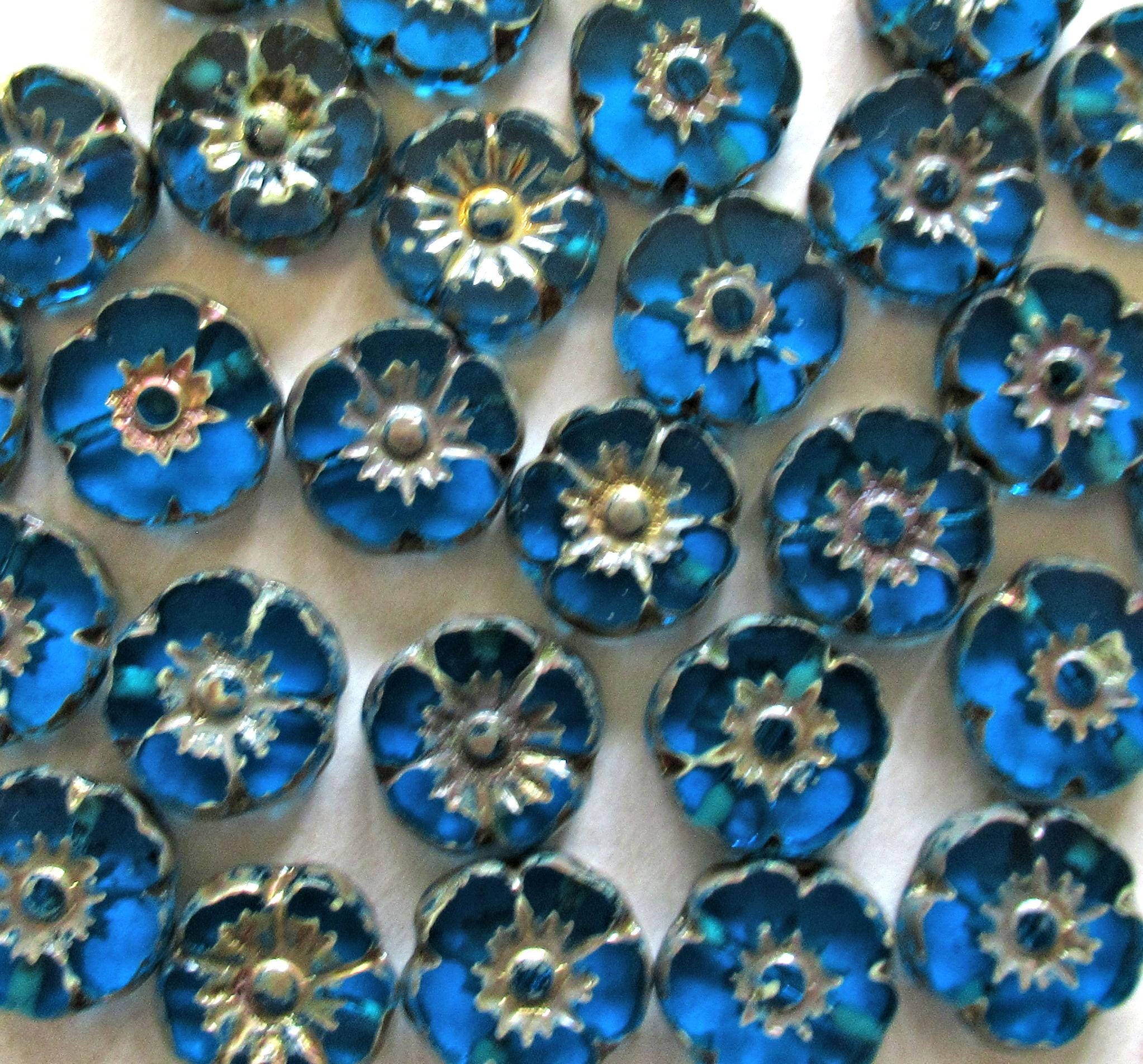 Ten Czech glass flower beads - 10mm - transparent capri blue picasso Hawaiian hibiscus flowers - table cut carved floral - C00101
