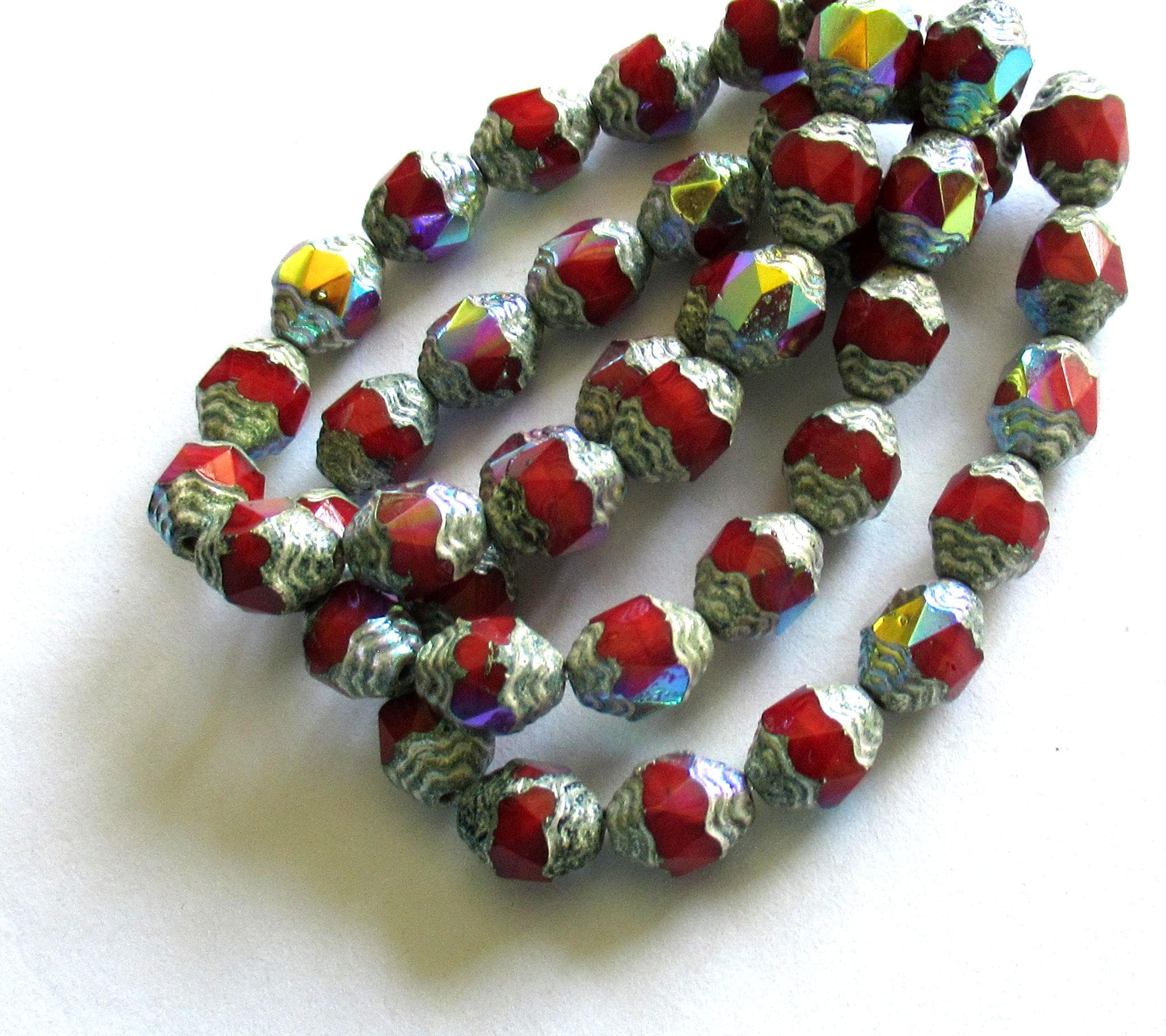 15 Czech glass mini antique style faceted oval beads - 8 x 6mm - red with silver accents & rainbow ab finish - cathedral beads - C00672