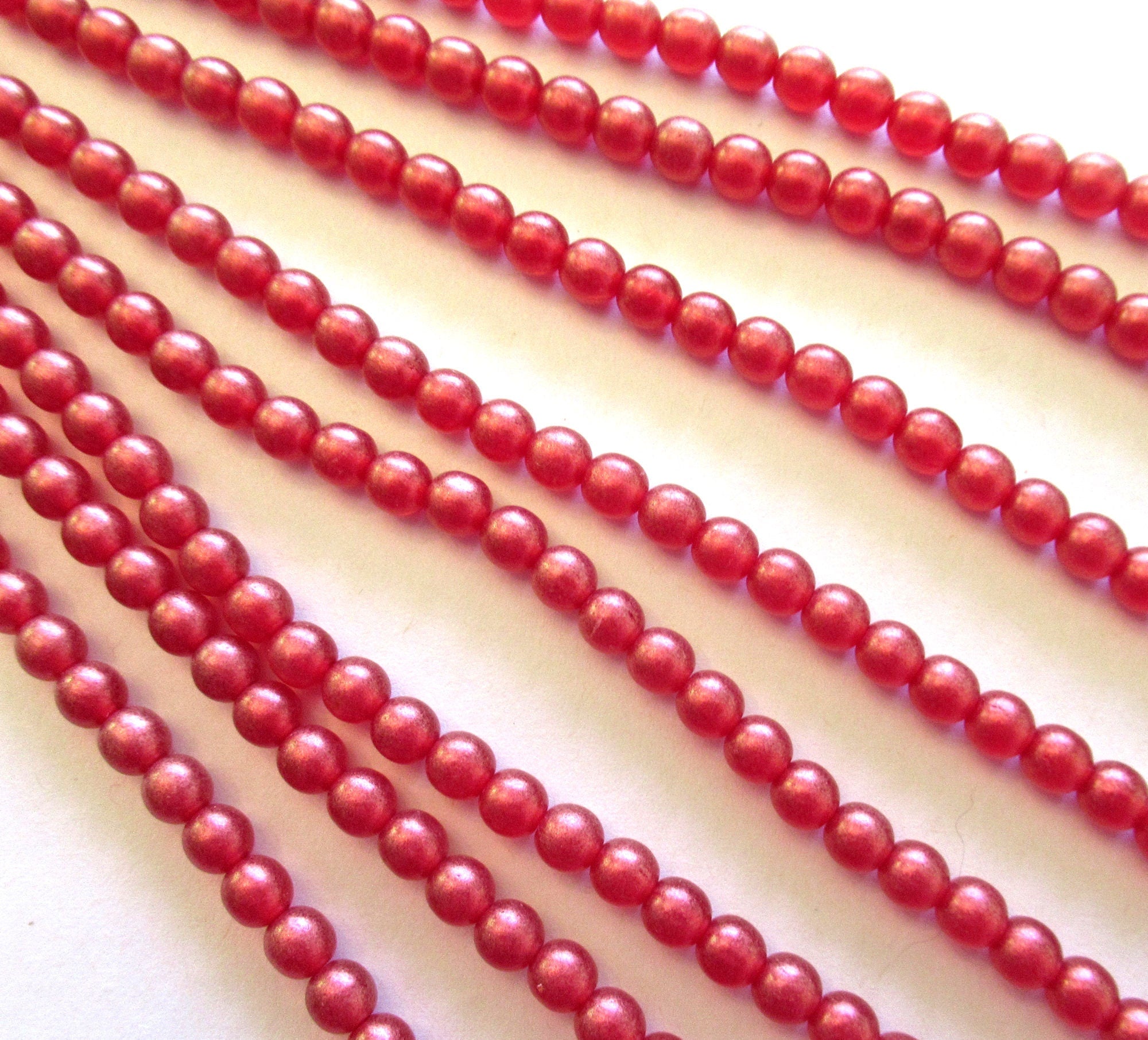 Fifty 6mm Czech glass druk beads - Cosmic Twinkle Siam Ruby Red smooth round druks - C0009